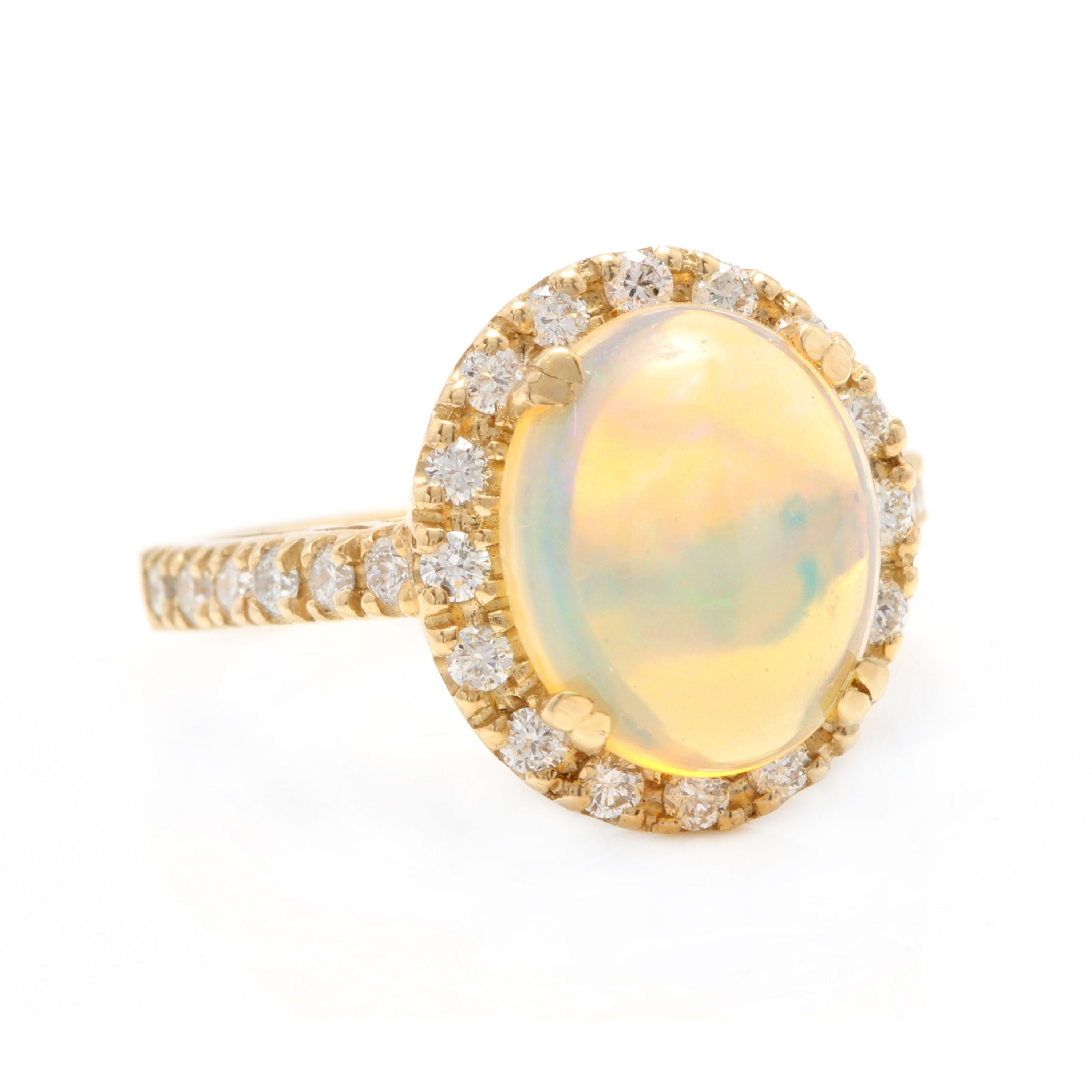 5.10 Carats Natural Impressive Ethiopian Opal and Diamond 14K Solid Yellow Gold Ring

Total Natural Opal Weight is: Approx. 4.50 Carats

Opal Measures: 12.00 x 10.00mm

Natural Round Diamonds Weight: Approx. 0.60 Carats (color G-H / Clarity