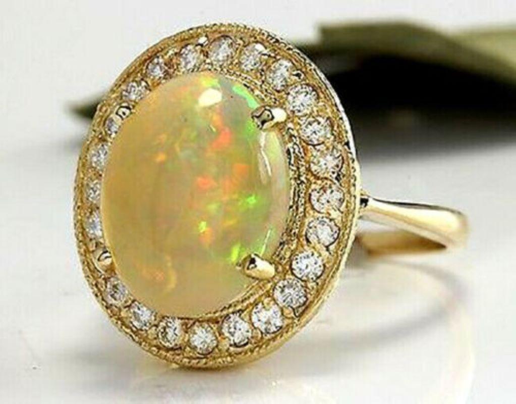 5.10 Carats Natural Impressive Ethiopian Opal and Diamond 14K Solid Yellow Gold Ring

Amazing play of colors opal. Pictures don't show the beauty of the opal.

Total Natural Opal Weight is: 4.30 Carats

Opal Measures: 13.70 x 10.73mm

Natural Round