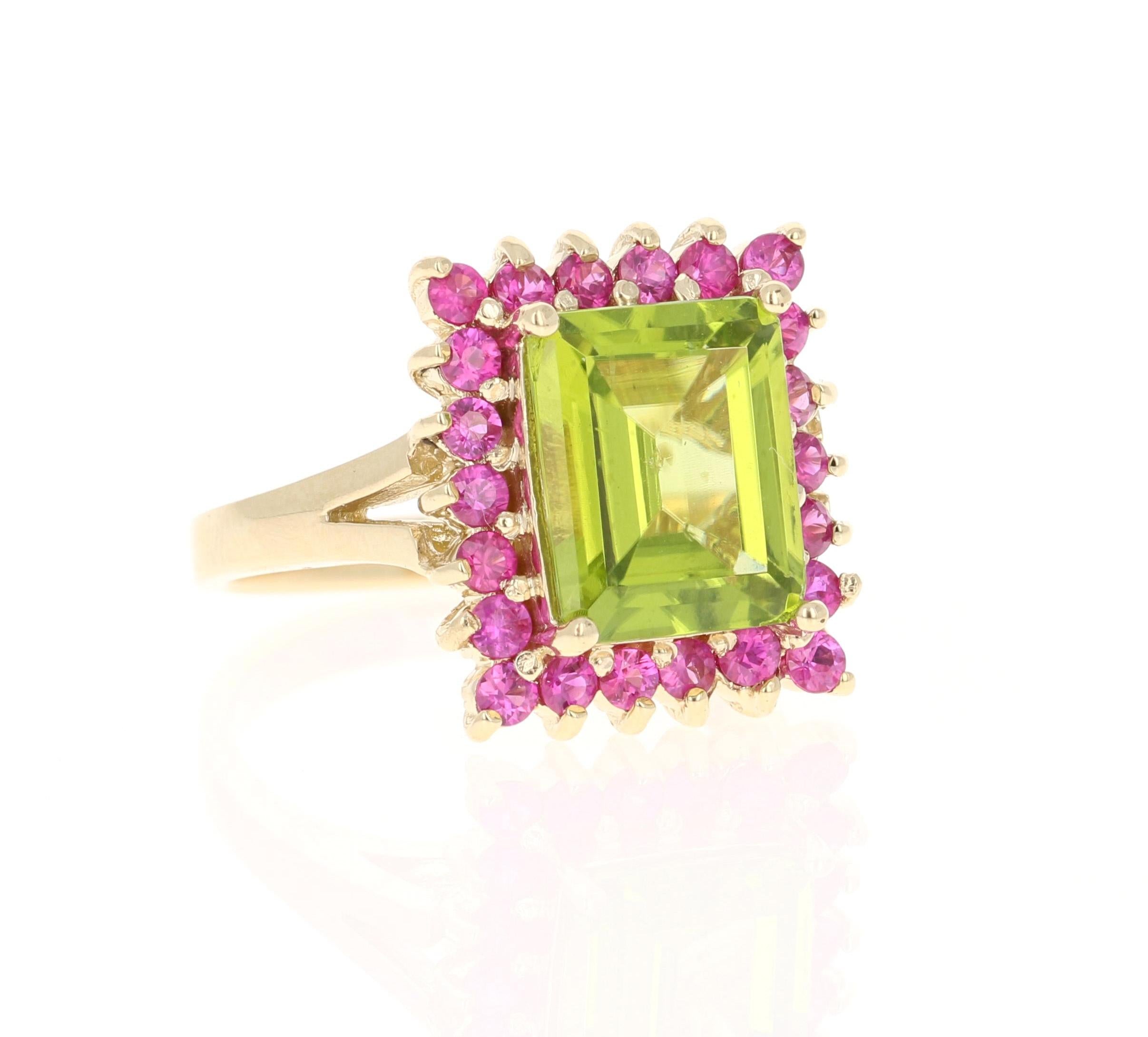 This ring has a 4.14 carat Peridot and 22 Pink Sapphires that weigh 0.96 Carats. The total carat weight of the ring is 5.10 Carats. 
Curated in 14 Karat Yellow Gold and weighs approximately 6.8 grams. 

The ring size is 7 and can be re-sized if