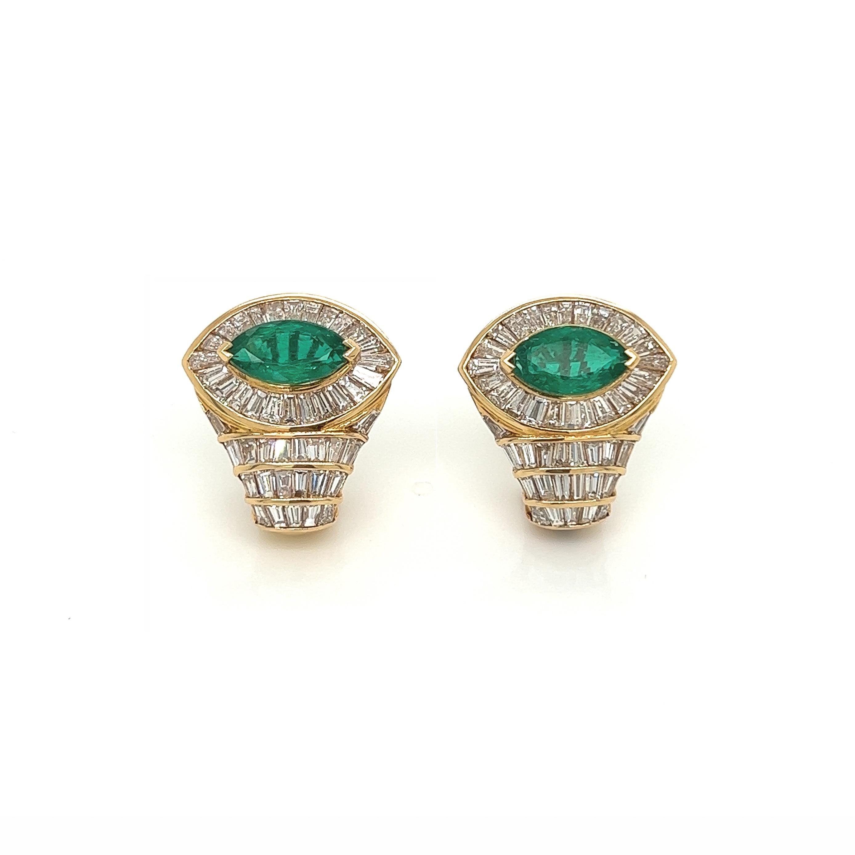 5.10 Total Carat 18K Yellow Gold Diamond & Colombian Marquise Emerald Earrings

SPECIFICATIONS:
-Main Stones: Marquise Cut Colombian Green Emeralds 2.50ct
-Side Stones: 2.60ct Baguette Cut Diamonds, F-G Color, VVS-VS Clarity
-Metal: 18K Yellow