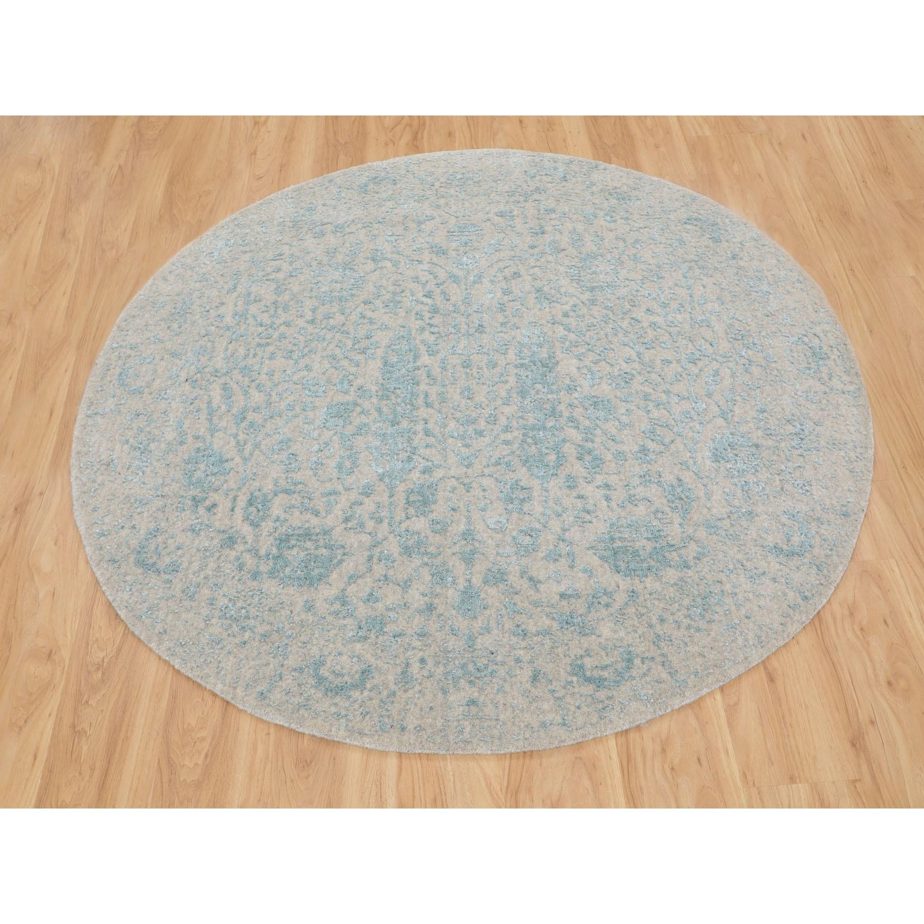 This is a truly genuine one-of-a-kind Green Broken Cypress Tree Design Wool And Silk Thick Hand Loomed Round Oriental Rug. It has been woven for months and months in the centuries-old Persian weaving craftsmanship techniques by expert