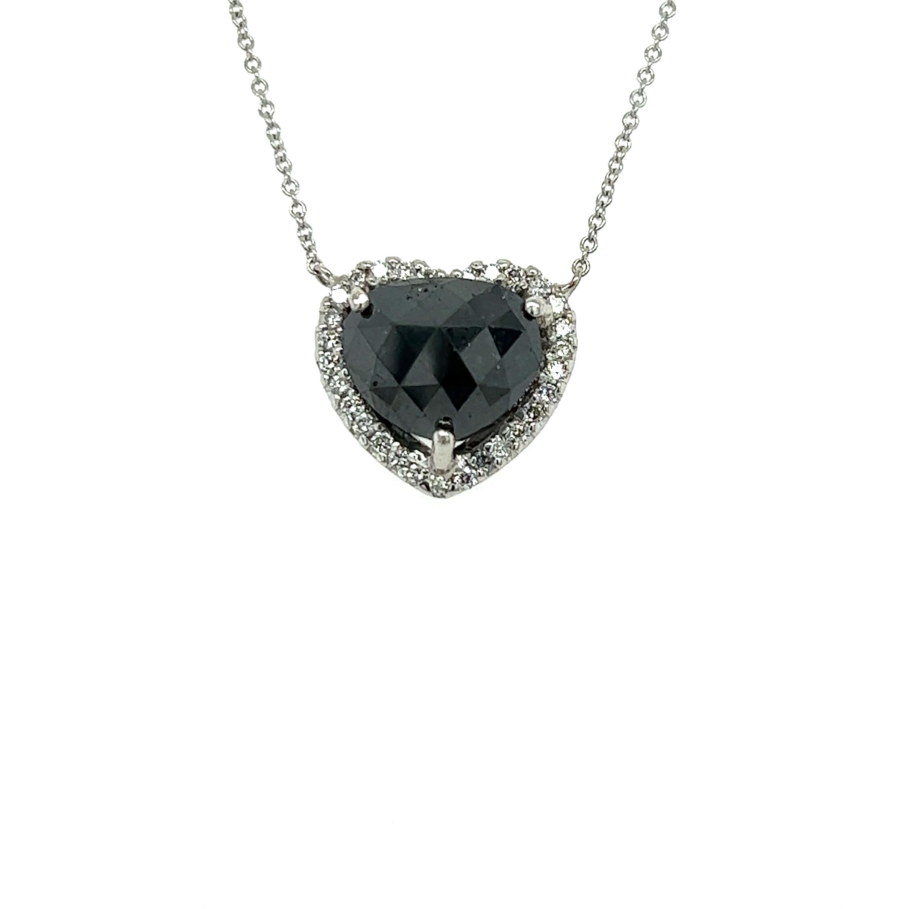 This beautiful necklace has a Natural Black Diamond that weighs 4.79 carats and also Natural Round Cut White Diamonds that weigh 0.32 carats. The black diamond is a wide fancy cut natural black diamond. 
The total carat weight of the necklace is