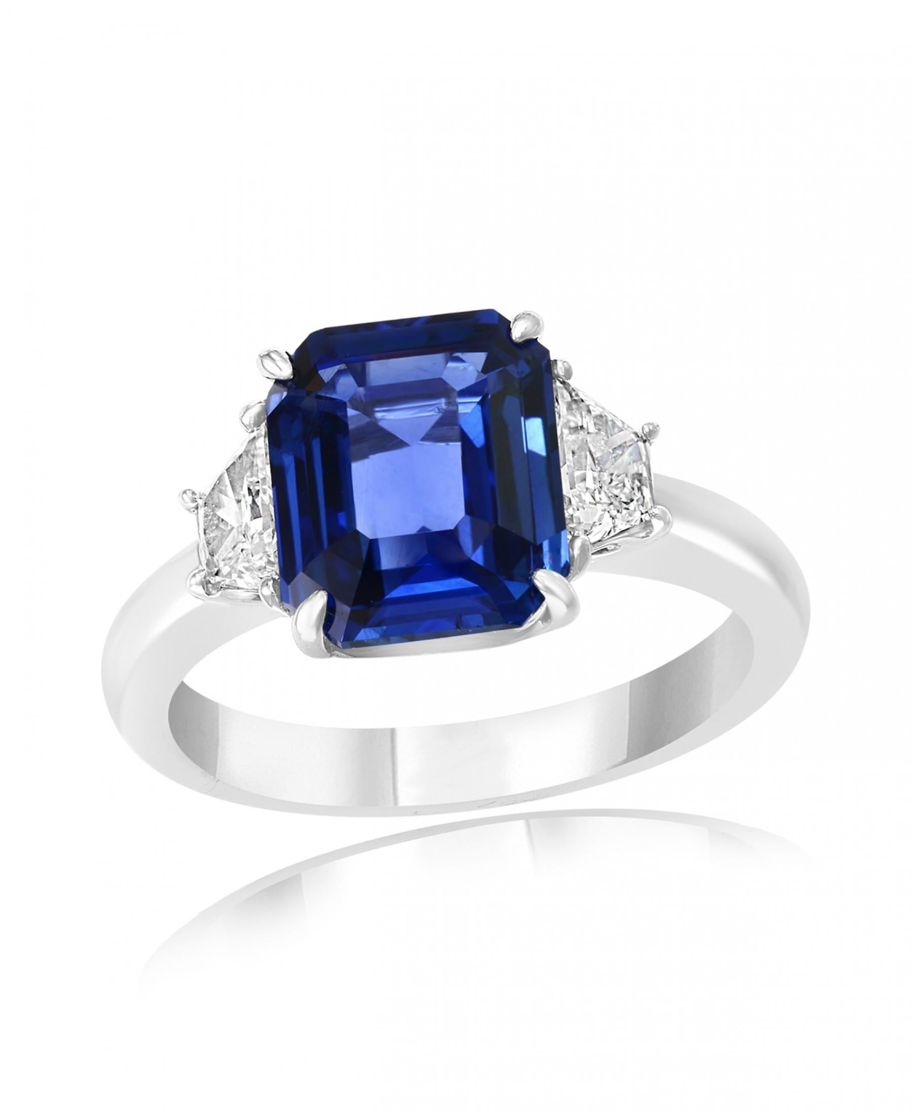 Women's or Men's 5.11 Carat Emerald Cut Sapphire with Two Accent Diamonds Totaling .52 Carat For Sale