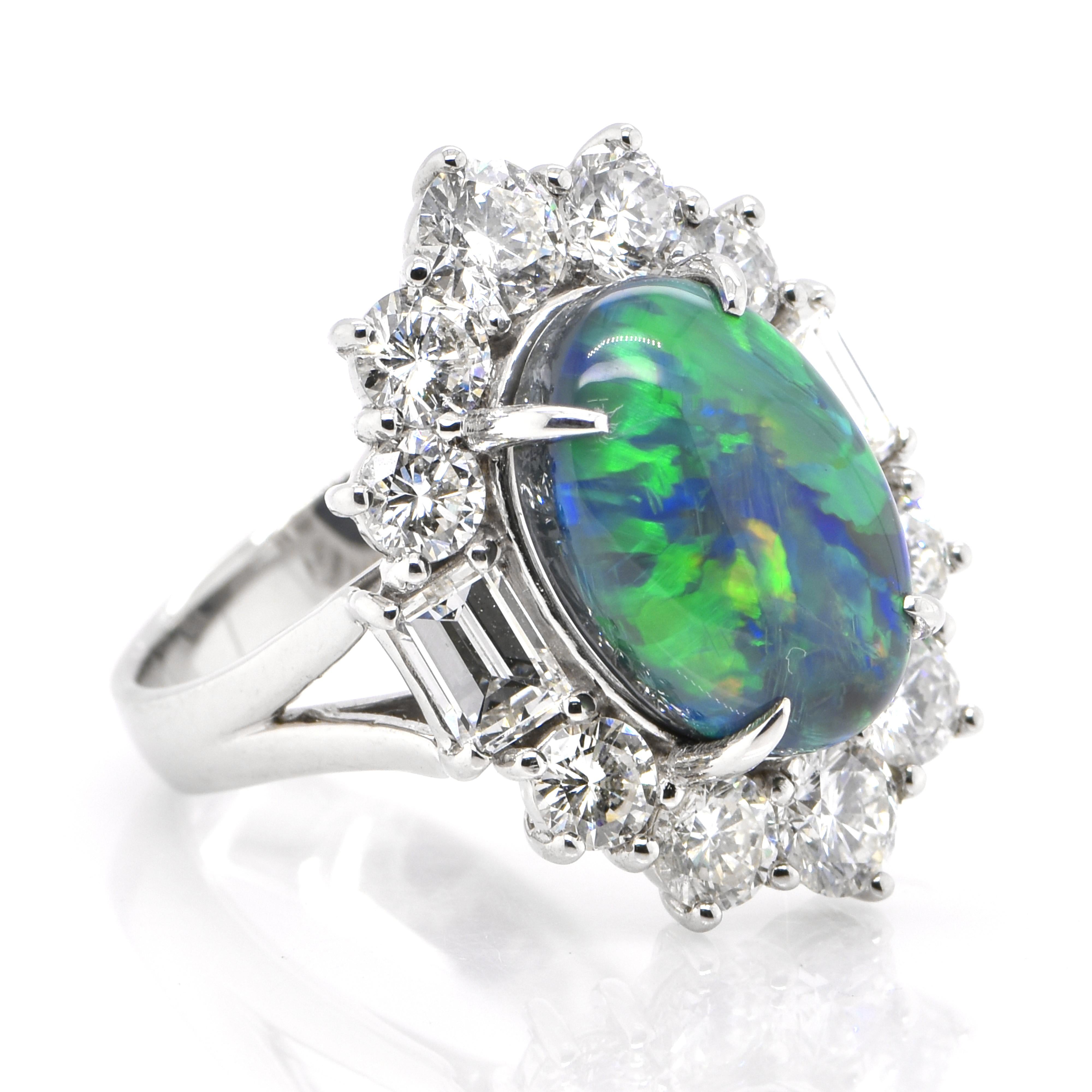 A beautiful ring featuring a 5.11 Carat, Natural, Australian (Lighting Ridge) Black Opal and 3.60 Carats of Diamond Accents set in Platinum. The Opal displays very good play of color! Opals are known for exhibiting flashes of rainbow colors known as