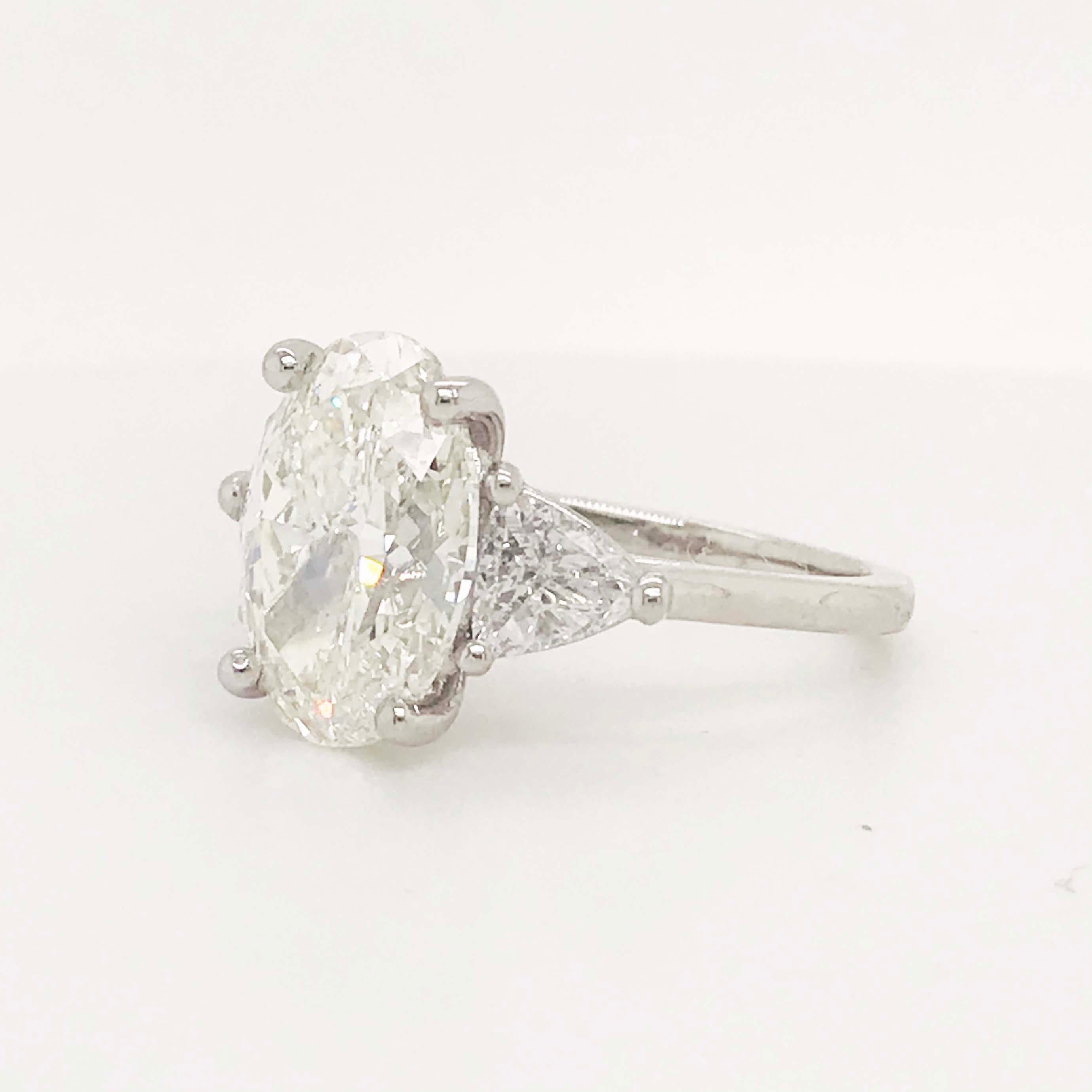 Oval Cut 5.88 Carat Oval Diamond Three-Stone Platinum Engagement Ring Trillion Diamonds