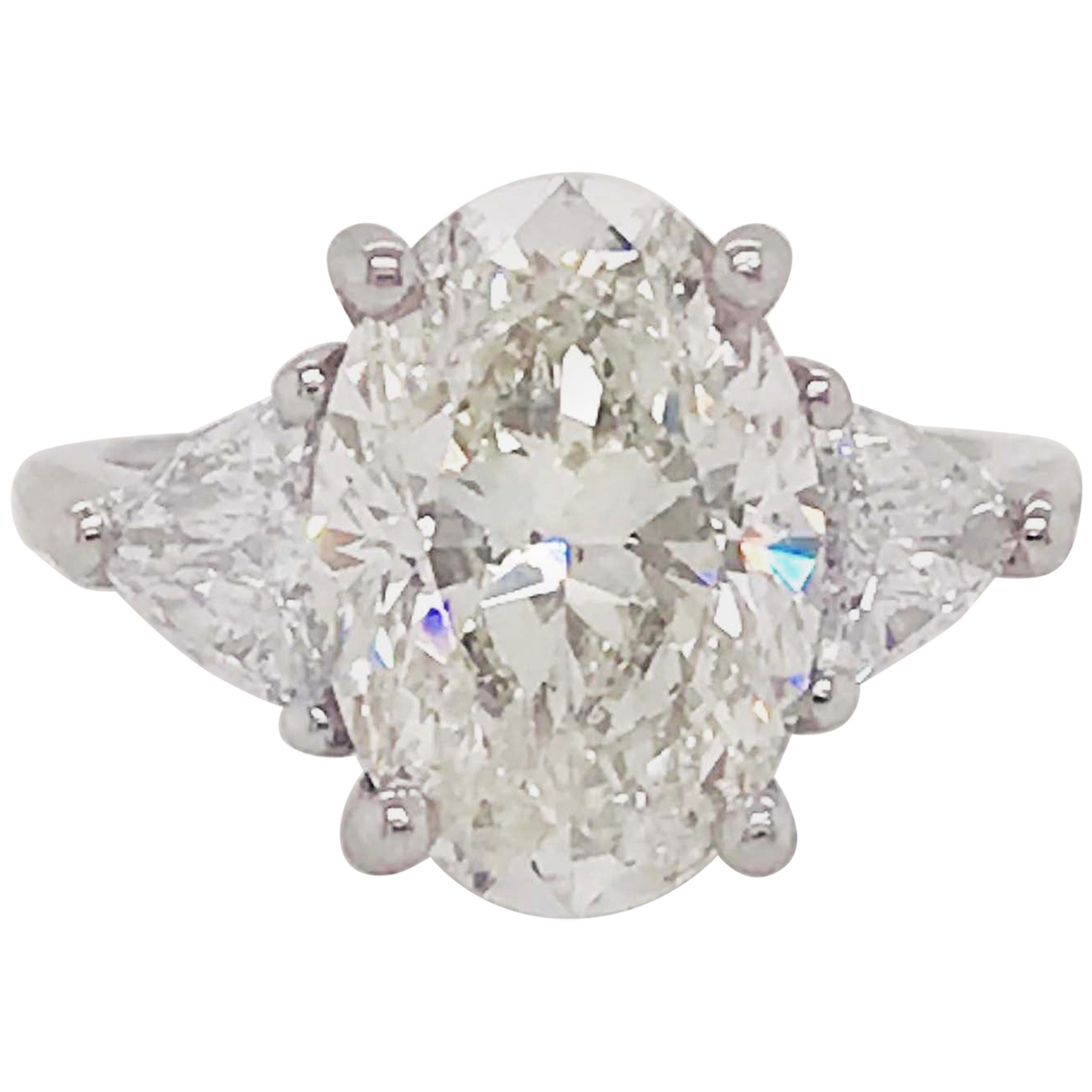 5.88 Carat Oval Diamond Three-Stone Platinum Engagement Ring Trillion Diamonds