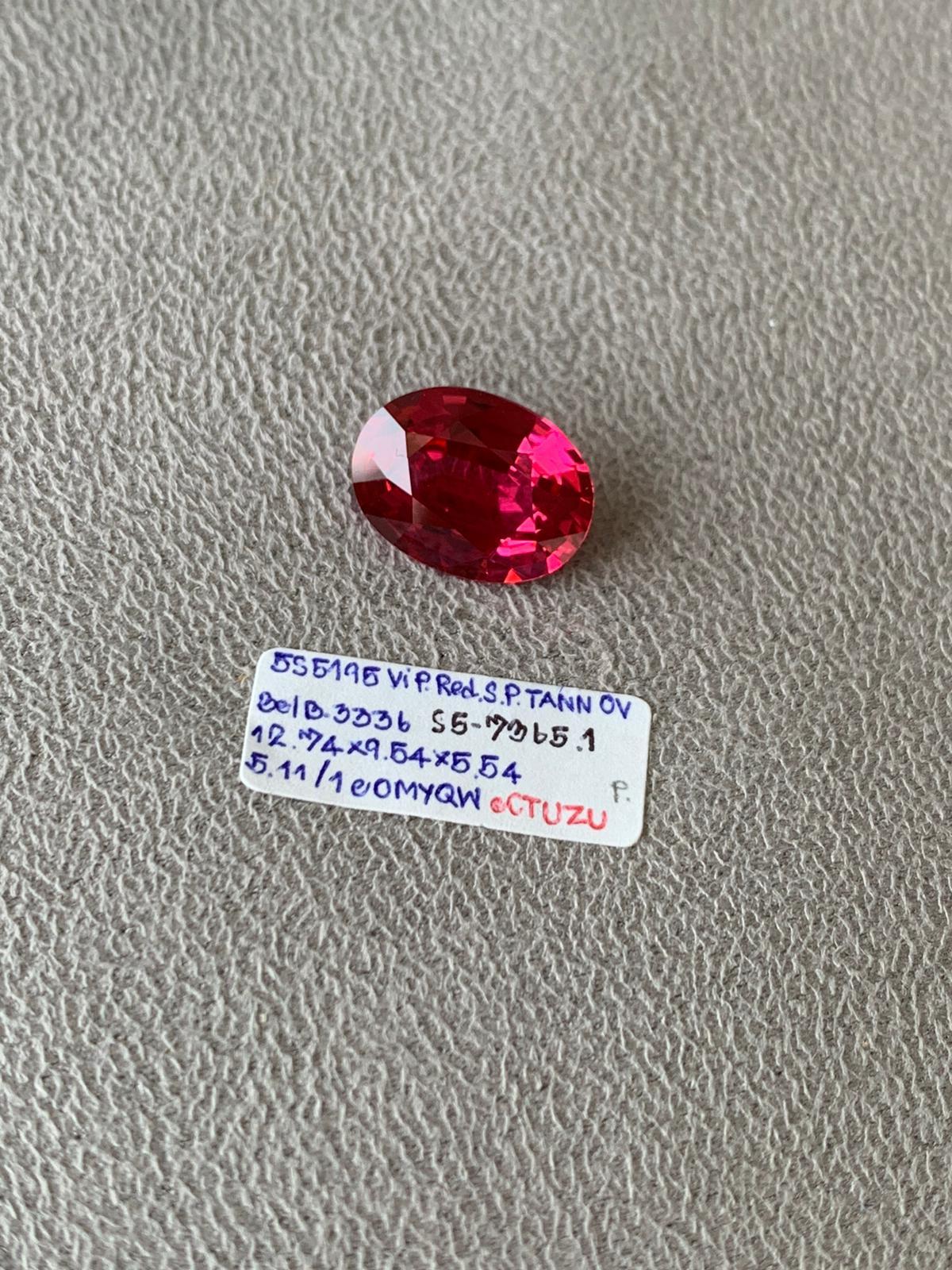 This Oval cut pinkish red spinel is 5.115cts. Completely eye and loupe clean this spinel shows off its natural sparkling color and has not been heat treated. Coming from the famous Mahenge area of Tanzania. Spinels of this quality and color are