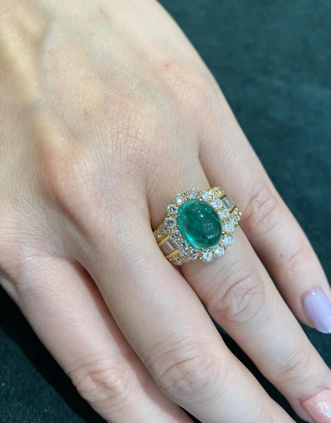 5.12 Carats Emerald Cabochon & Diamond Ring in 18k Yellow Gold

Emerald Cabochon and Diamond Ring features one center Cabochon Emerald accented by Baguettes and Round Brilliant cut Diamonds set in 18k Yellow Gold.

Total emerald weight is 5.12