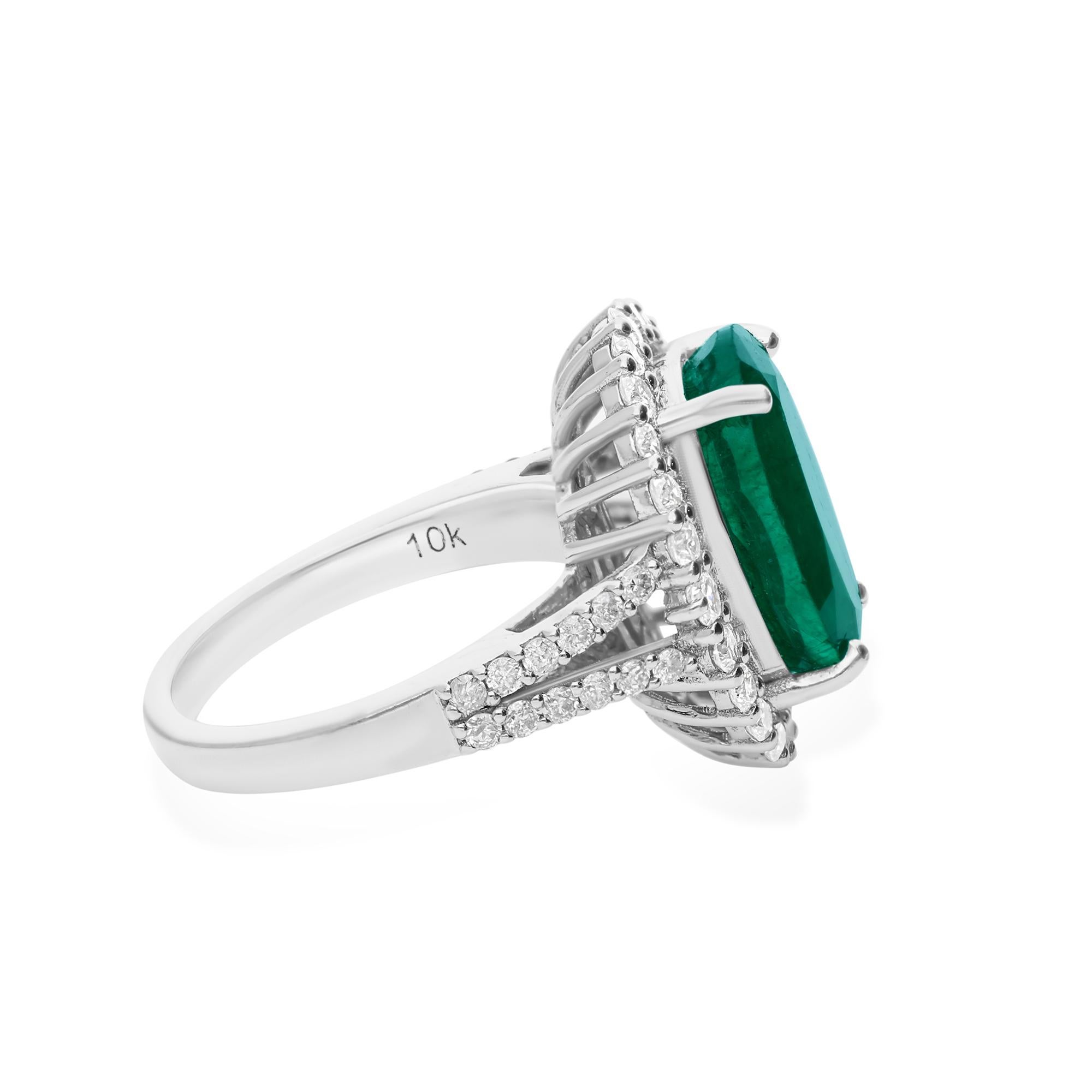 A cocktail ring featuring an oval-shaped emerald gemstone and diamonds in 10 karat white gold is a glamorous and striking piece of fine jewelry. The ring typically showcases a large oval-shaped emerald as the central feature, accented by