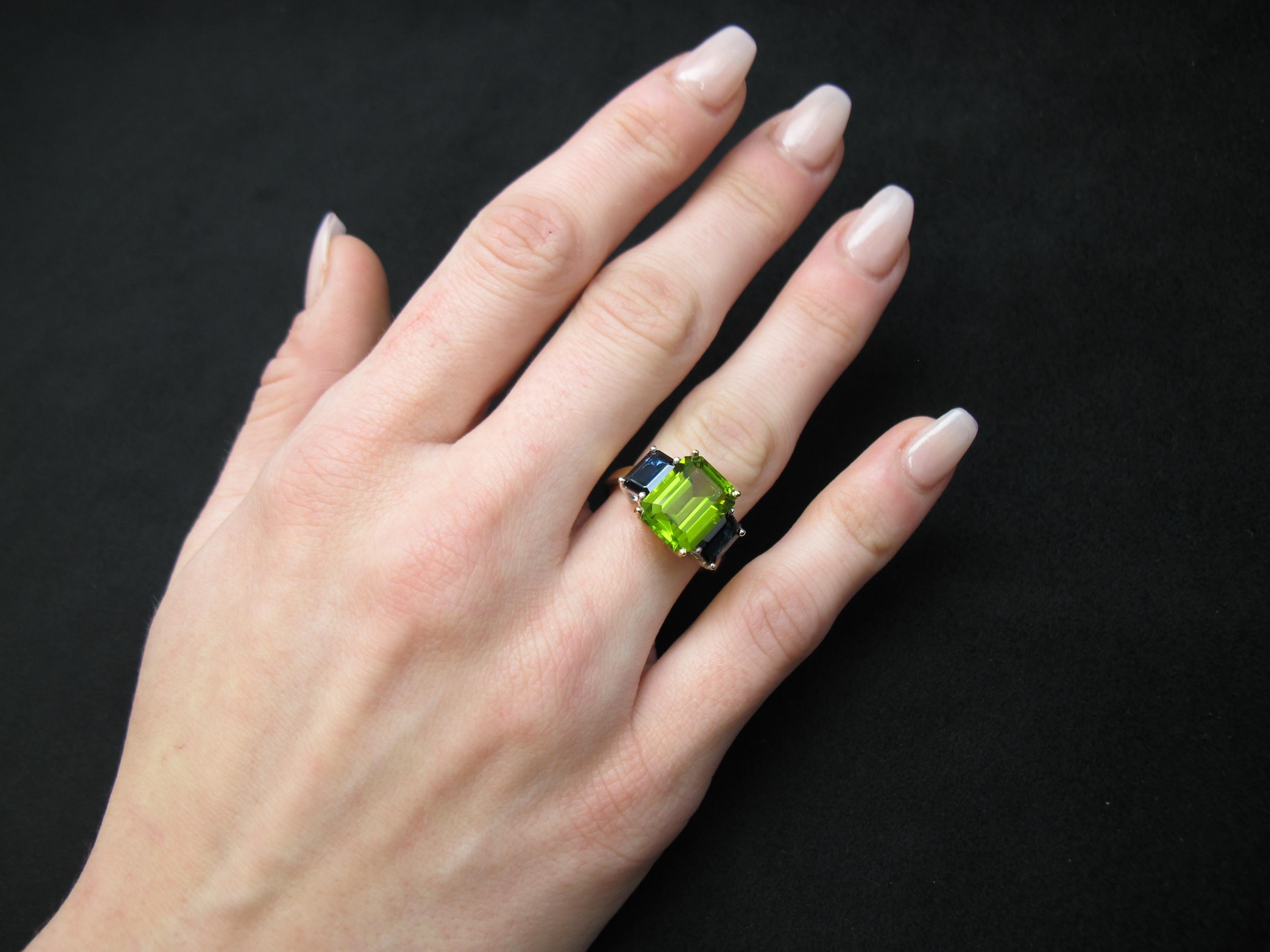 Women's 5 Carat Peridot and Blue Sapphire Three-Stone Ring in White and Yellow Gold For Sale