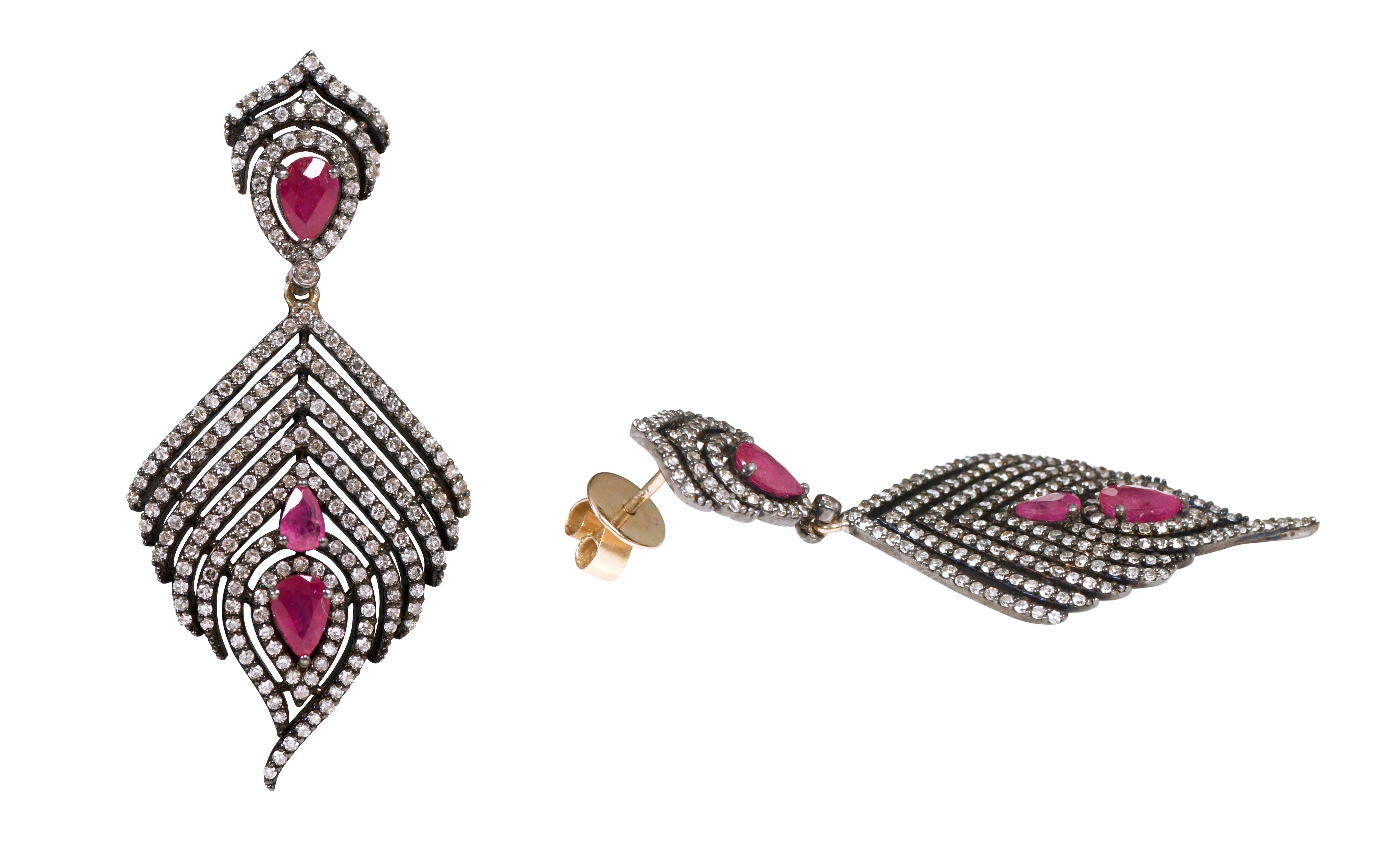 5.12 Carat Ruby and Diamond Drop Earrings in Victorian Style

This Victorian period immersive art-deco style wine red ruby and diamond long feathery earring is glorious. The bottom comprehensive feather design with pave set round diamond in the