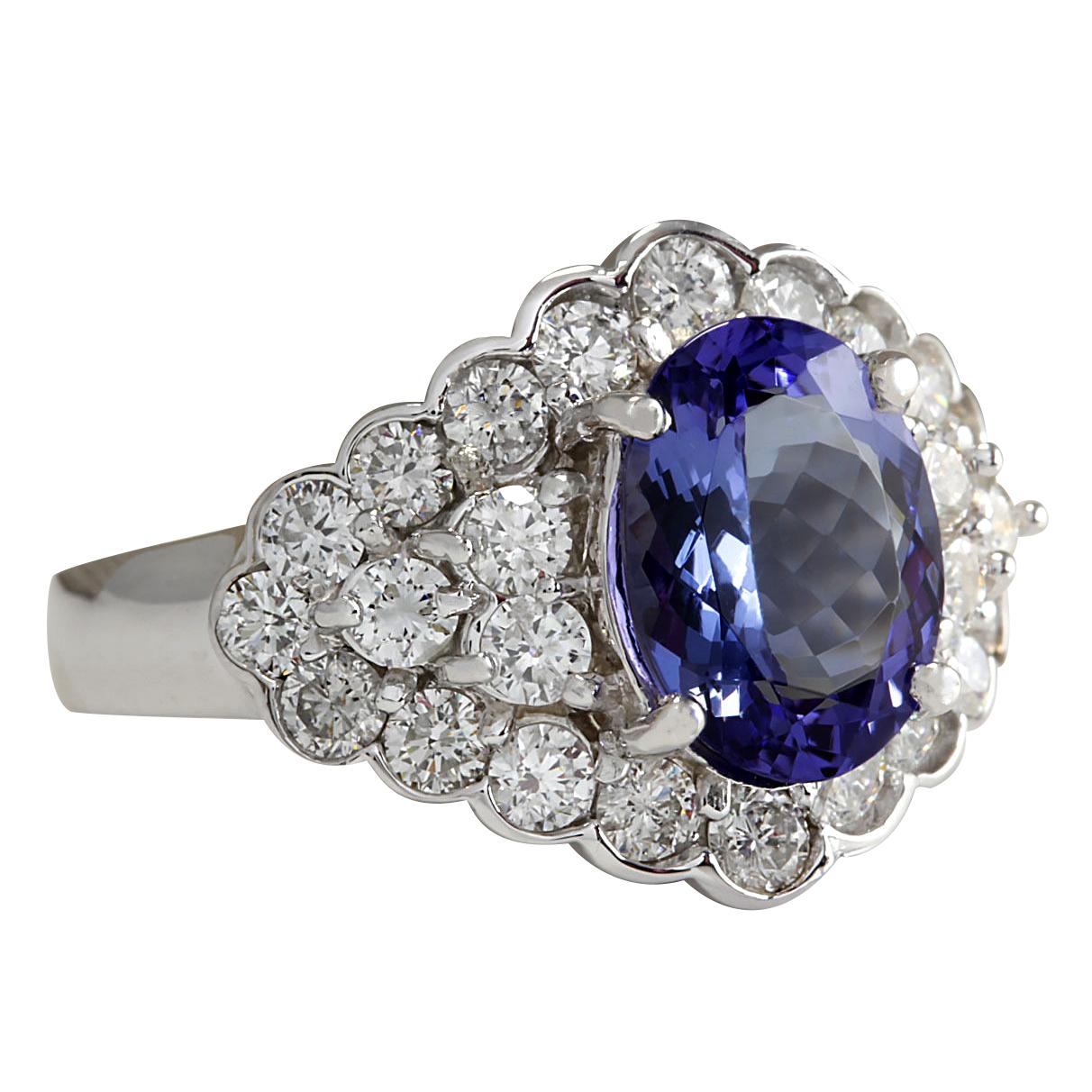 Stamped: 18K White Gold
Total Ring Weight: 8.5 Grams
Ring Length: N/A
Ring Width: N/A
Gemstone Weight: Total  Tanzanite Weight is 3.32 Carat (Measures: 11.25x8.83 mm)
Color: Blue
Diamond Weight: Total  Diamond Weight is 1.80 Carat
Color: F-G,