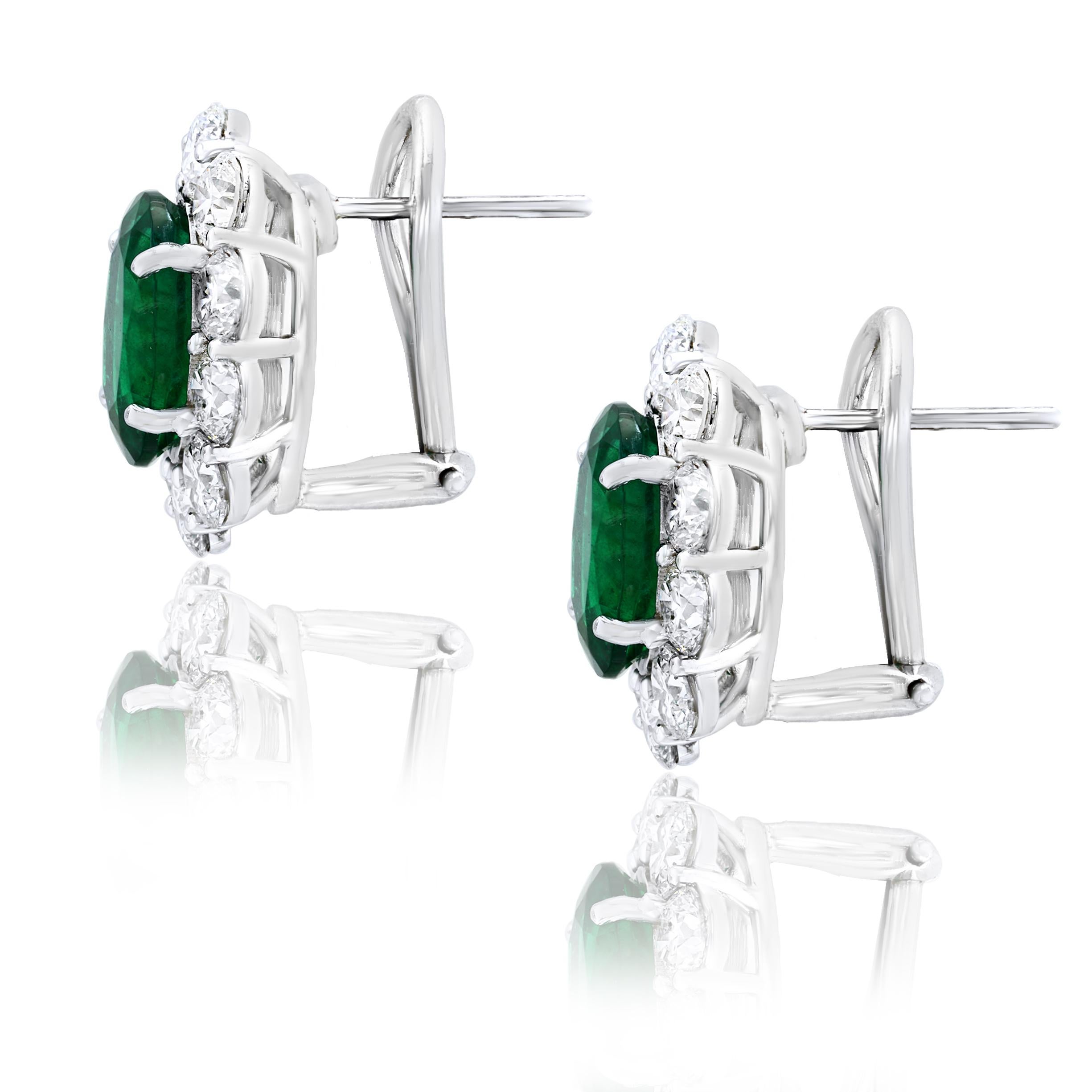 Modern 5.13 Carat Oval Cut Emerald and Diamond Halo Earrings in 18K White Gold For Sale