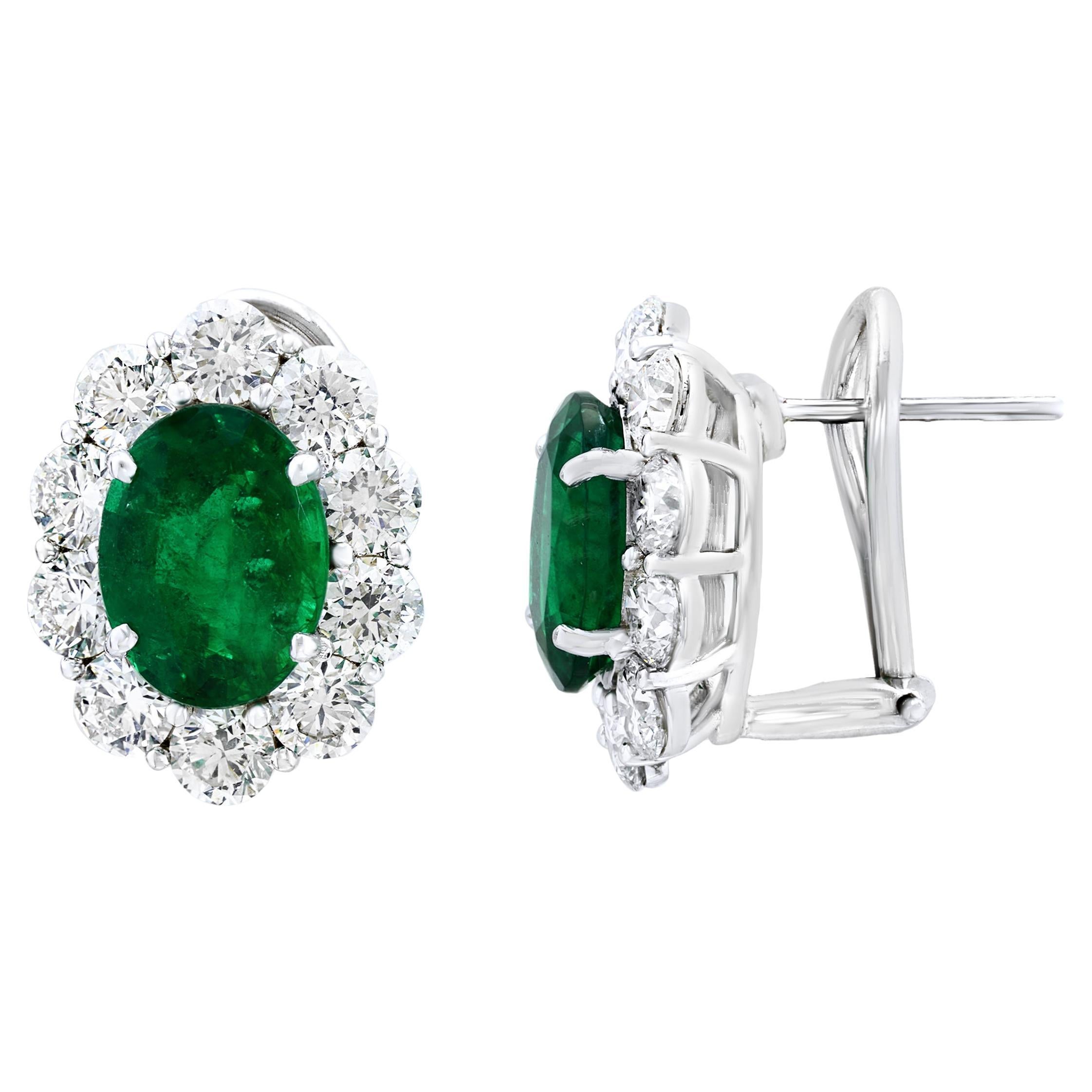 5.13 Carat Oval Cut Emerald and Diamond Halo Earrings in 18K White Gold For Sale