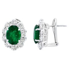 5.13 Carat Oval Cut Emerald and Diamond Halo Earrings in 18K White Gold