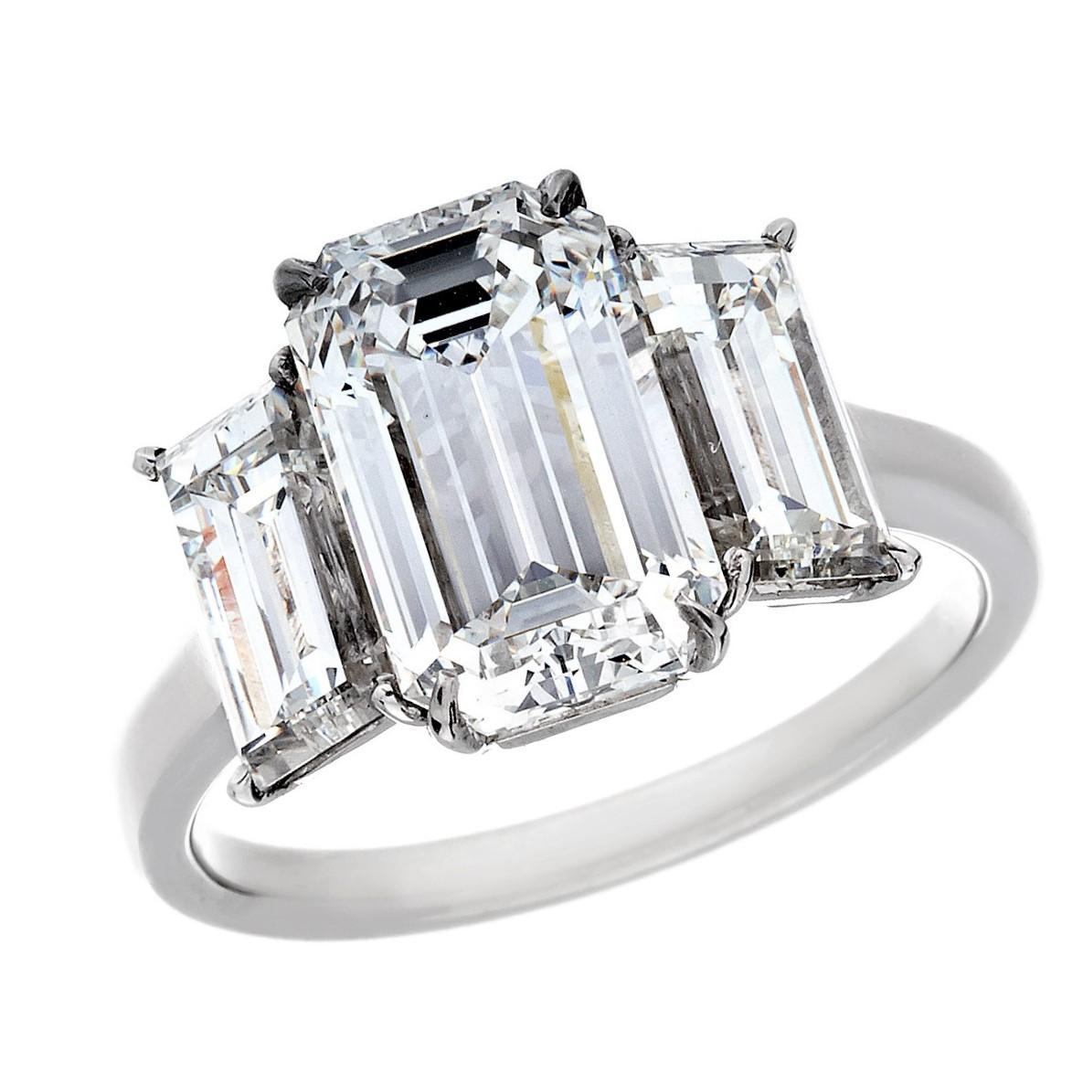 Platinum 3.01 Carat Emerald Cut Diamond 3-Stone Ring (The Center Stone
GIA Certified  D color VS1 Clarity See Enclosed Cert
Side Diamonds: 2.12 carats total
The Mounting is hand made for the diamonds.
The look is just incredibly elegant and