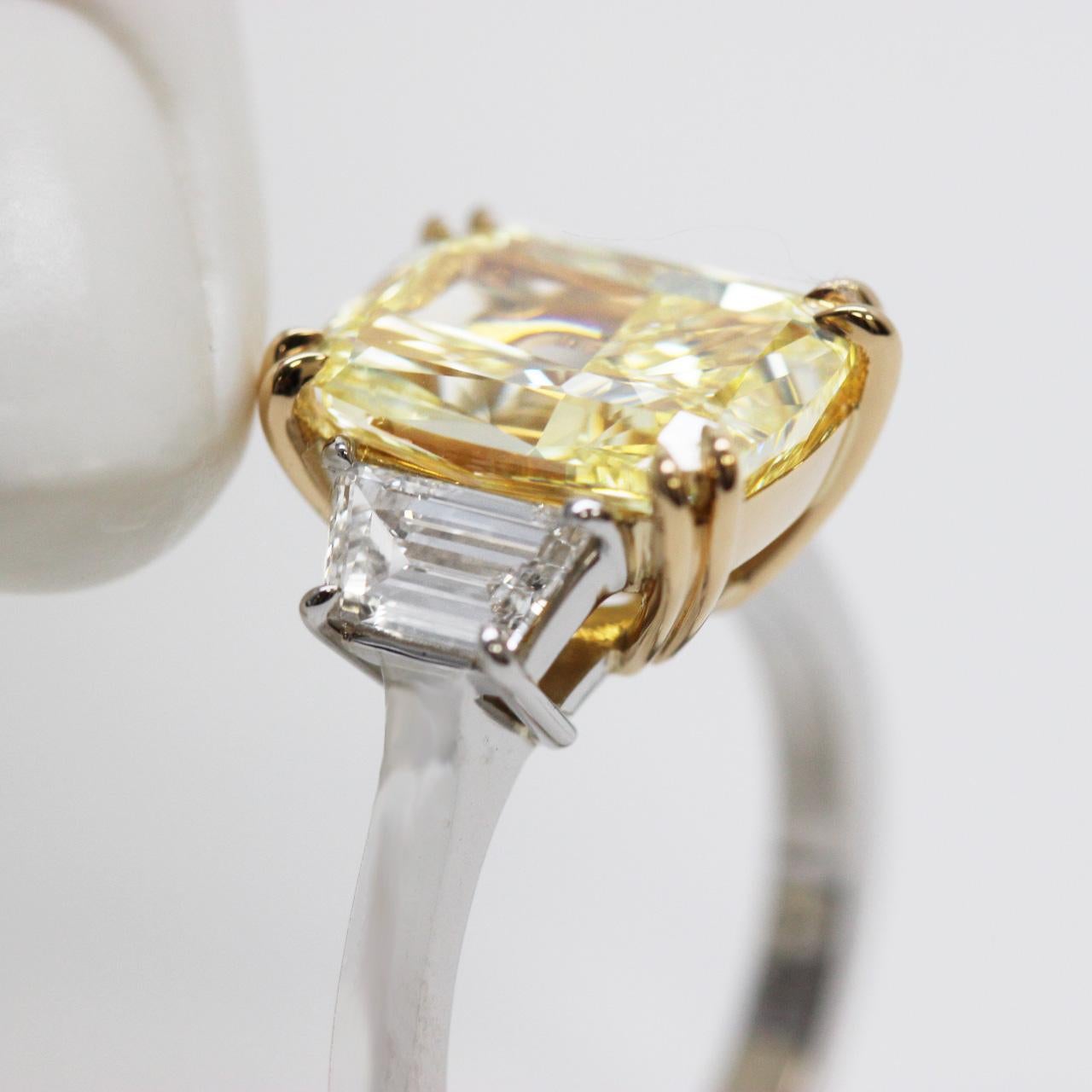 5.13 Ct Fancy Intense Yellow Cushion Cut Diamond Three-Stone Engagement Ring GIA In New Condition For Sale In New York, NY