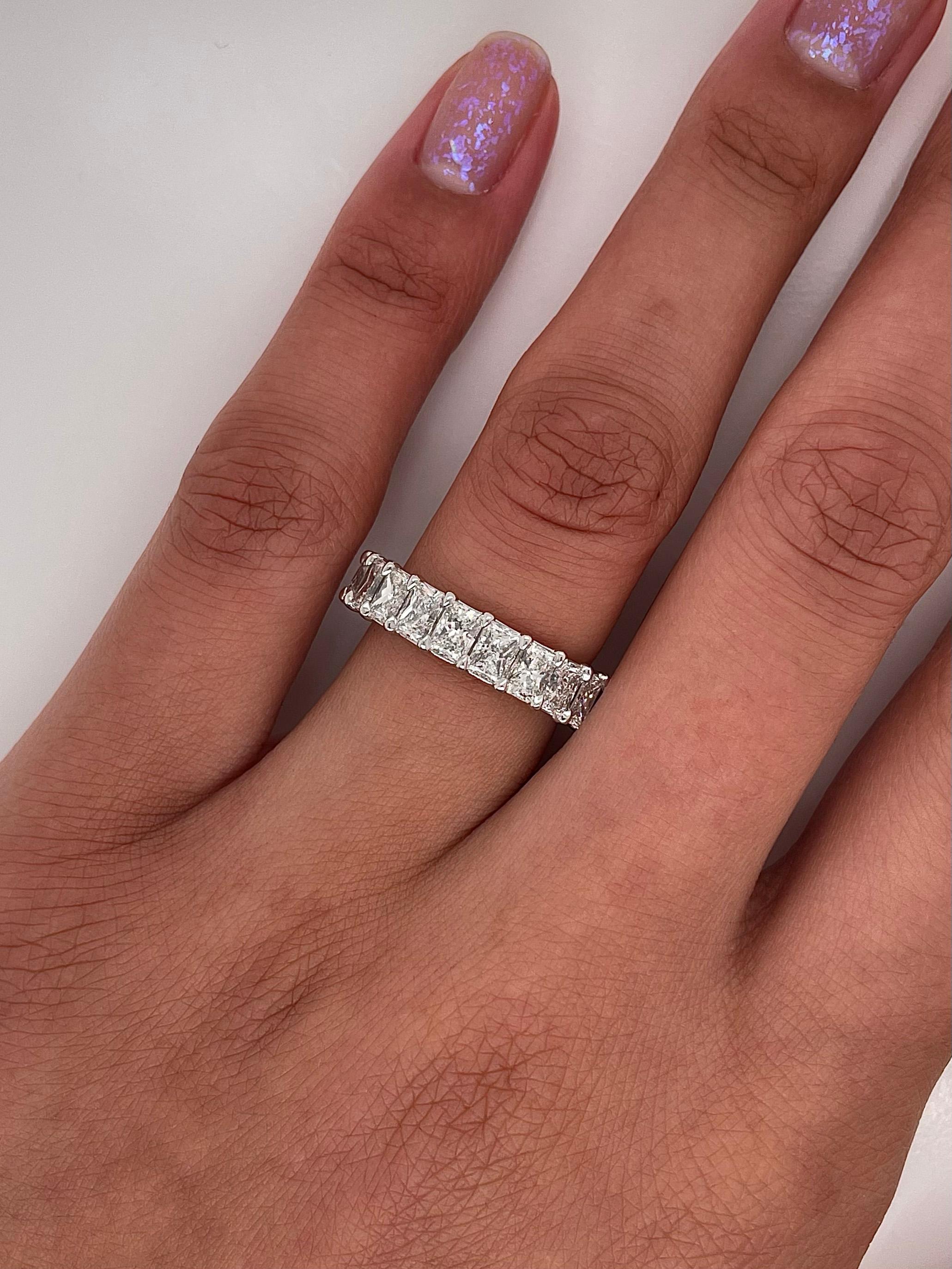 Ladies diamond Eternity band carries 5.13ct of radiant diamonds placed in platinum.

Size: 6.0
Color: G
Clarity: VS1

This shared prong style Eternity band was handmade by our jewelers in New York City 