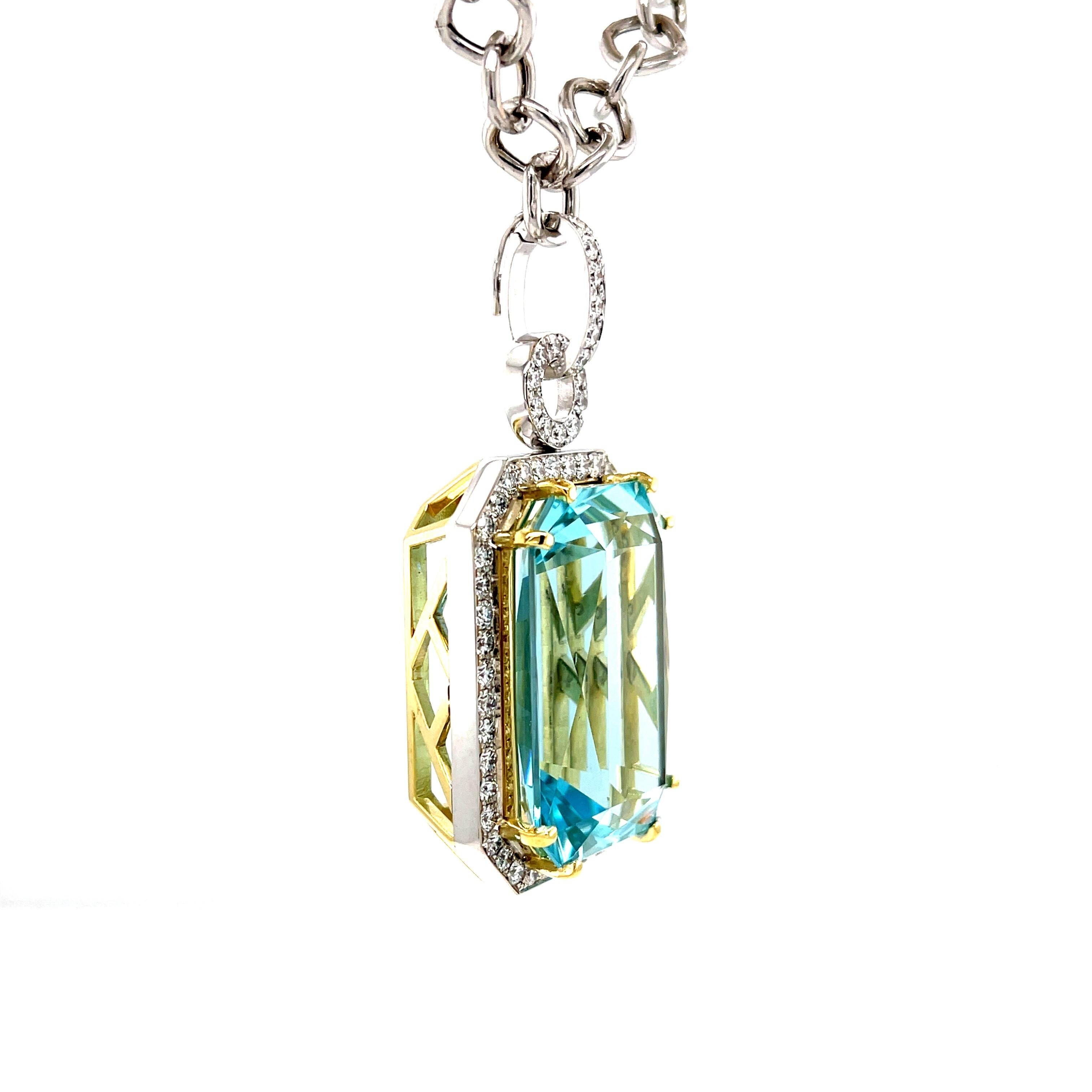 This stunning necklace features a magnificent 51.47 carat emerald-cut aquamarine with extraordinary blue color! The gem is surrounded by fine diamonds in an original pendant that is beautiful from every angle. The aquamarine is a perfectly