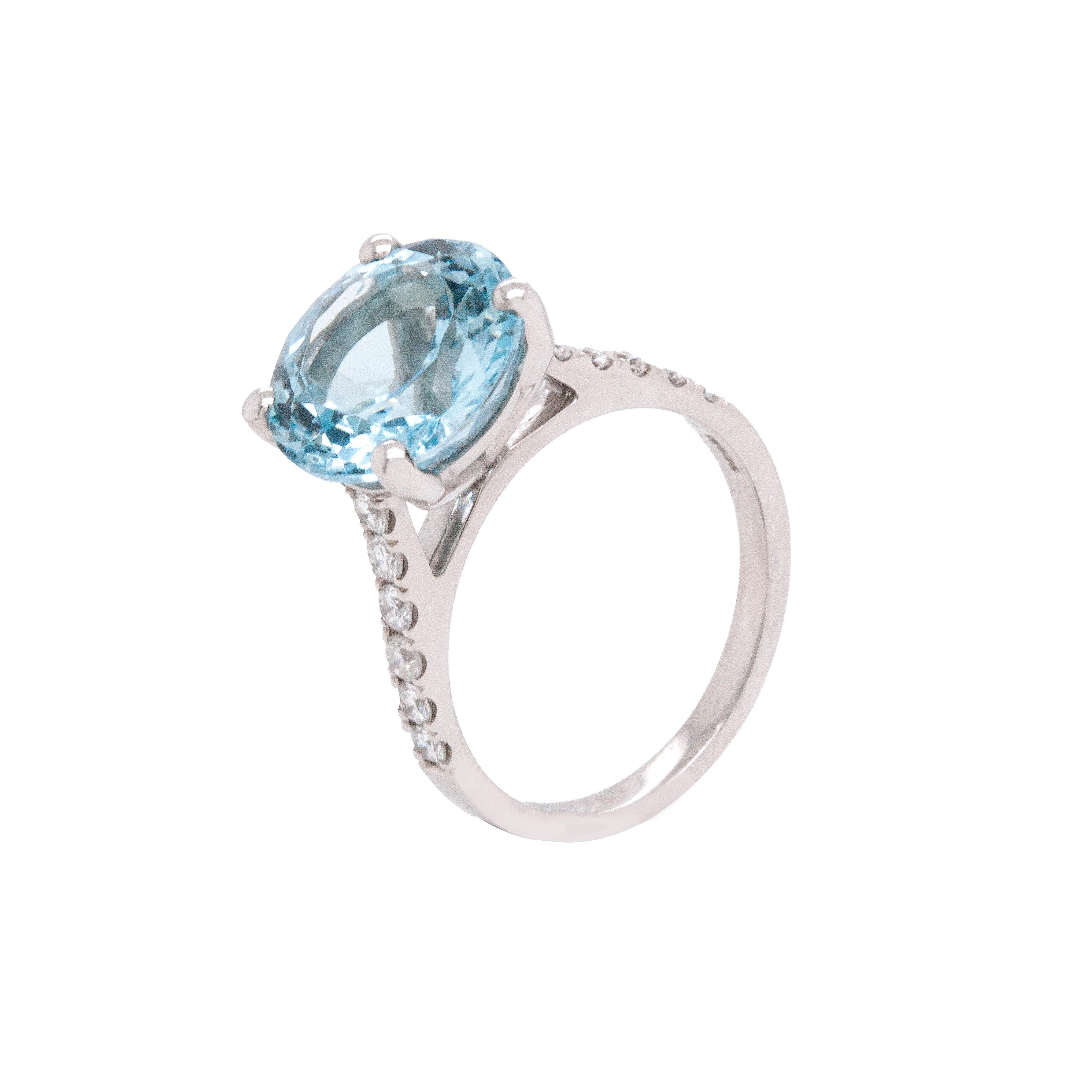 Introducing the most outstanding and wonderful engagement ring, masterfully crafted from high polish 18 carat white gold.

This exquisite ring features a mesmerising 5.14ct round aquamarine in a serene, light blue colour, securely held in the centre