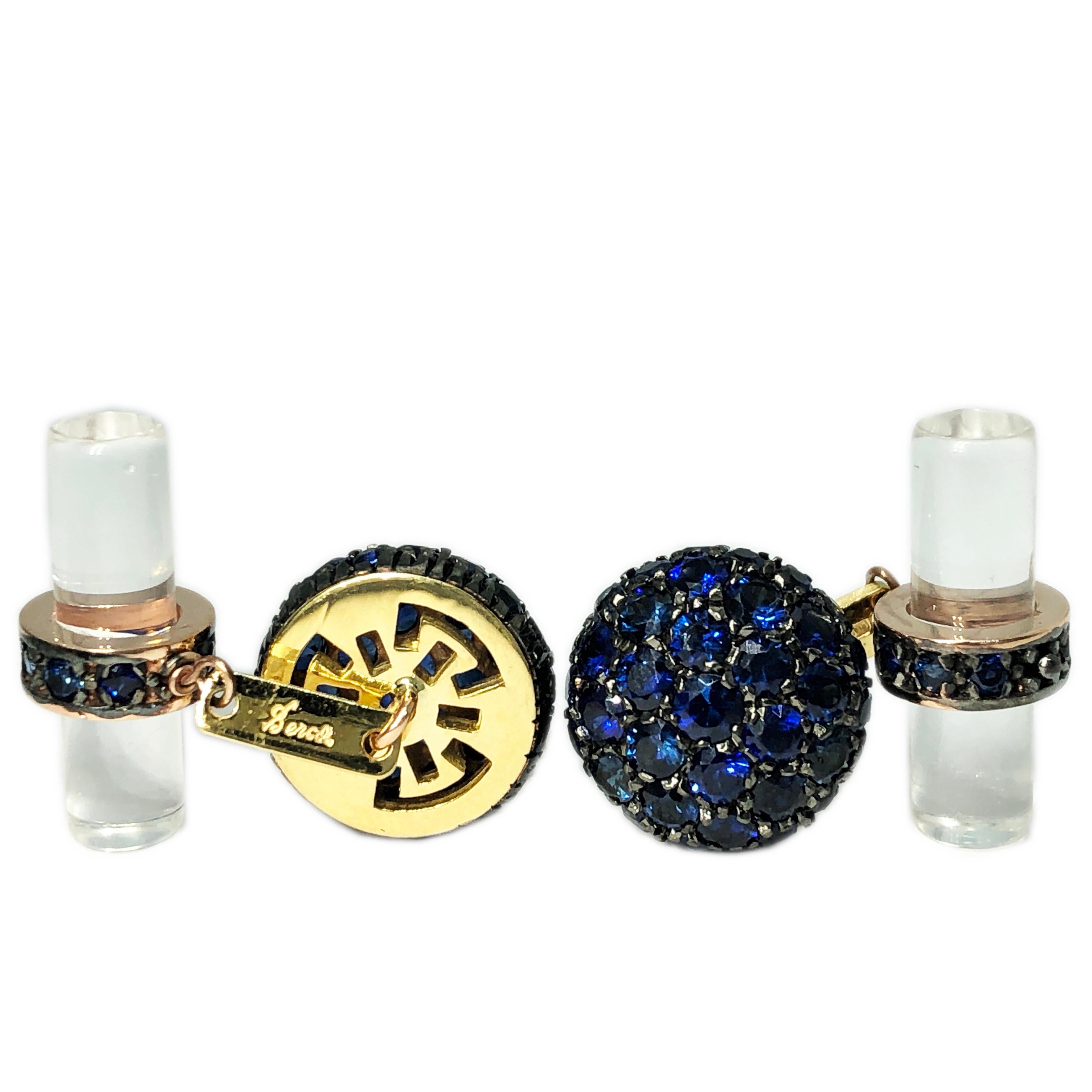 Smart, Chic and Timeless 5.63 Carat Round, Brilliant Cut Natural Blue Sapphire in an Oxidized Black and Yellow 18K Gold Setting, 12.40 Carat Natural Hand Inlaid Rock Crystal Baton Back.
In our fitted Tobacco Leather Case.
