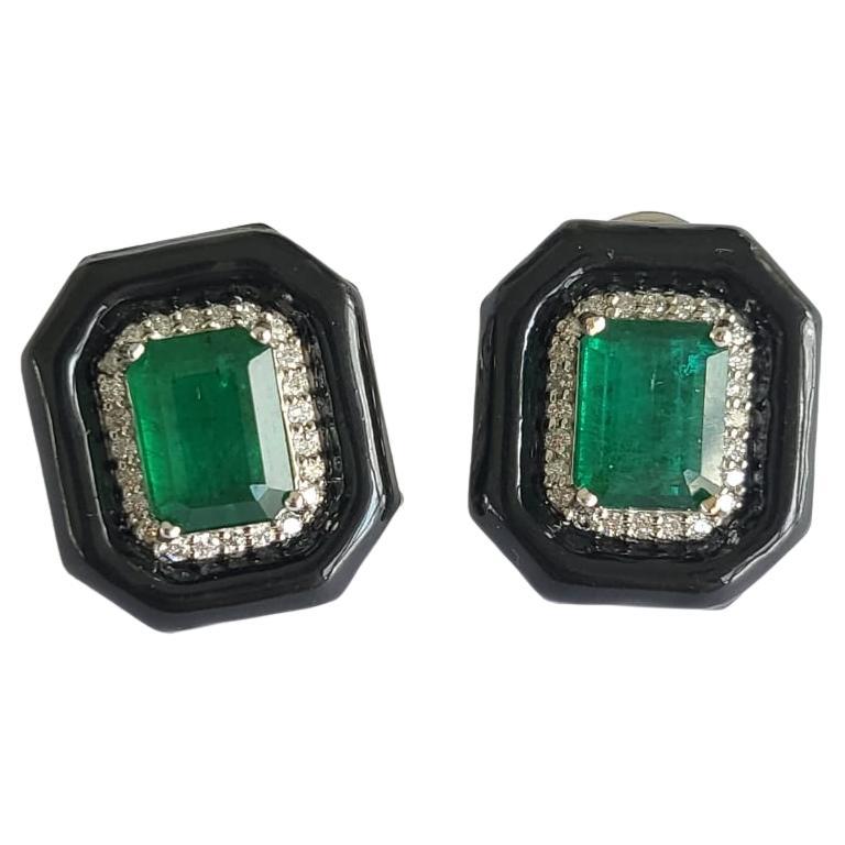 A very gorgeous and one of a kind, Art - Deco style, Emerald & Black Enamel Stud Earrings set in 18K Gold & Diamonds. The weight of the Emeralds is 5.15 carats. The Emeralds are completely natural, without any treatment and is of Zambian origin. The