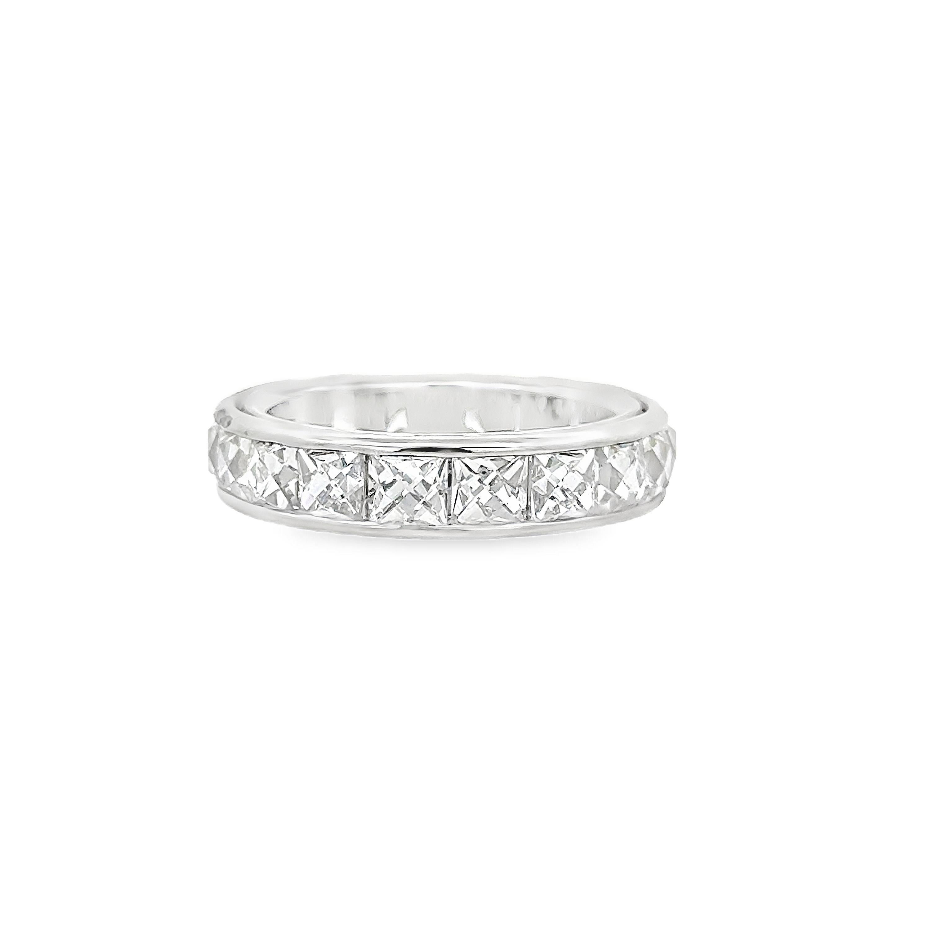 A unique eternity wedding band ring, featuring 20 square French cut diamonds weighing 5.15 carats total with F+ color and VS+ clarity. Diamonds are channel-set beautifully on a platinum mounting with a thin airline gallery, Size 6.5 US. 

Roman