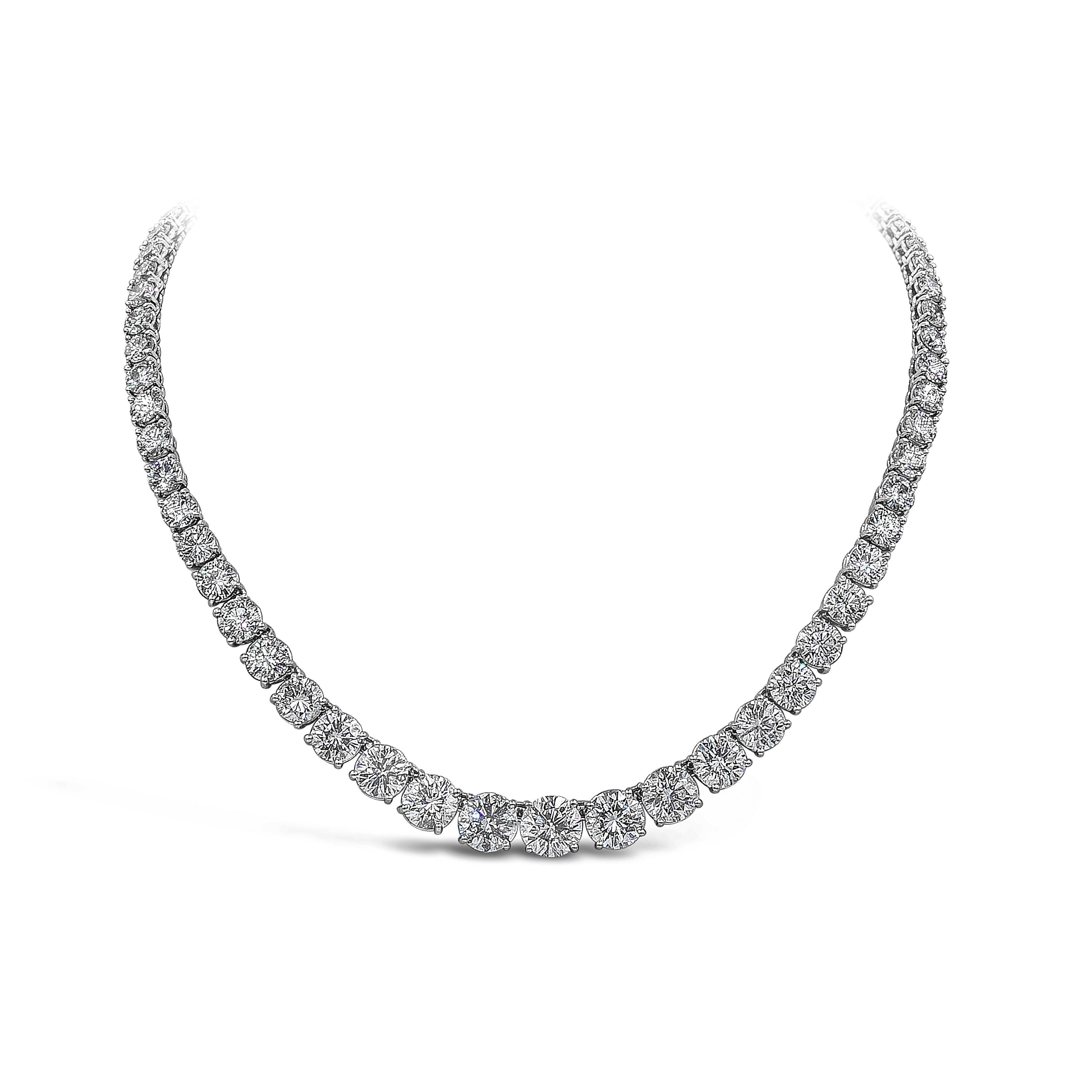 An important and brilliant riviere tennis necklace showcasing graduating 69 pieces of brilliant round diamonds from center to end weighing 51.59 carats total, approximately F-G Color and I1 in Clarity. The largest middle diamond is 2.90 Carats and