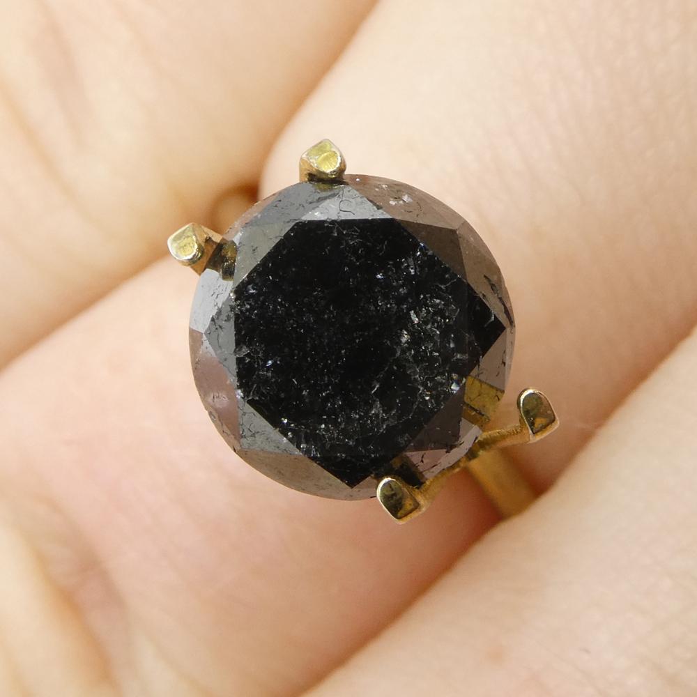 Description:

Gem Type: Diamond 
Number of Stones: 1
Weight: 5.15 cts
Measurements: 9.72 x 9.72 x 7.72 mm
Shape: Round
Cutting Style Crown: Brilliant Cut
Cutting Style Pavilion: Brilliant Cut 
Transparency: Opaque
Clarity: N/A
Colour: Black
Hue: