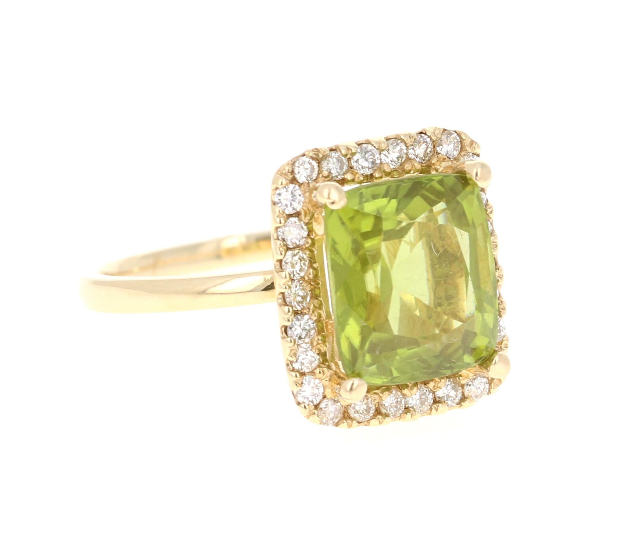 This Peridot and Diamond Ring has a 4.72 Carat Emerald Cut Peridot and has a halo of 26 Round Cut Diamonds weighing 0.44 Carats. The total carat weight of the ring is 5.16 Carats. 

It is set in 14 Karat Yellow Gold and weighs approximate 3.6 grams.