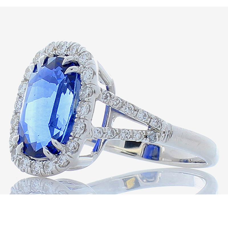 A ring fit for a queen! Your eye will be drawn magnetically to the 5.17 carat – 11.28 x 8.14 millimeter royal blue sapphire that is surrounded by a dazzling halo of round brilliant diamonds. The sapphire is from Sri Lanka. The color is royal blue;