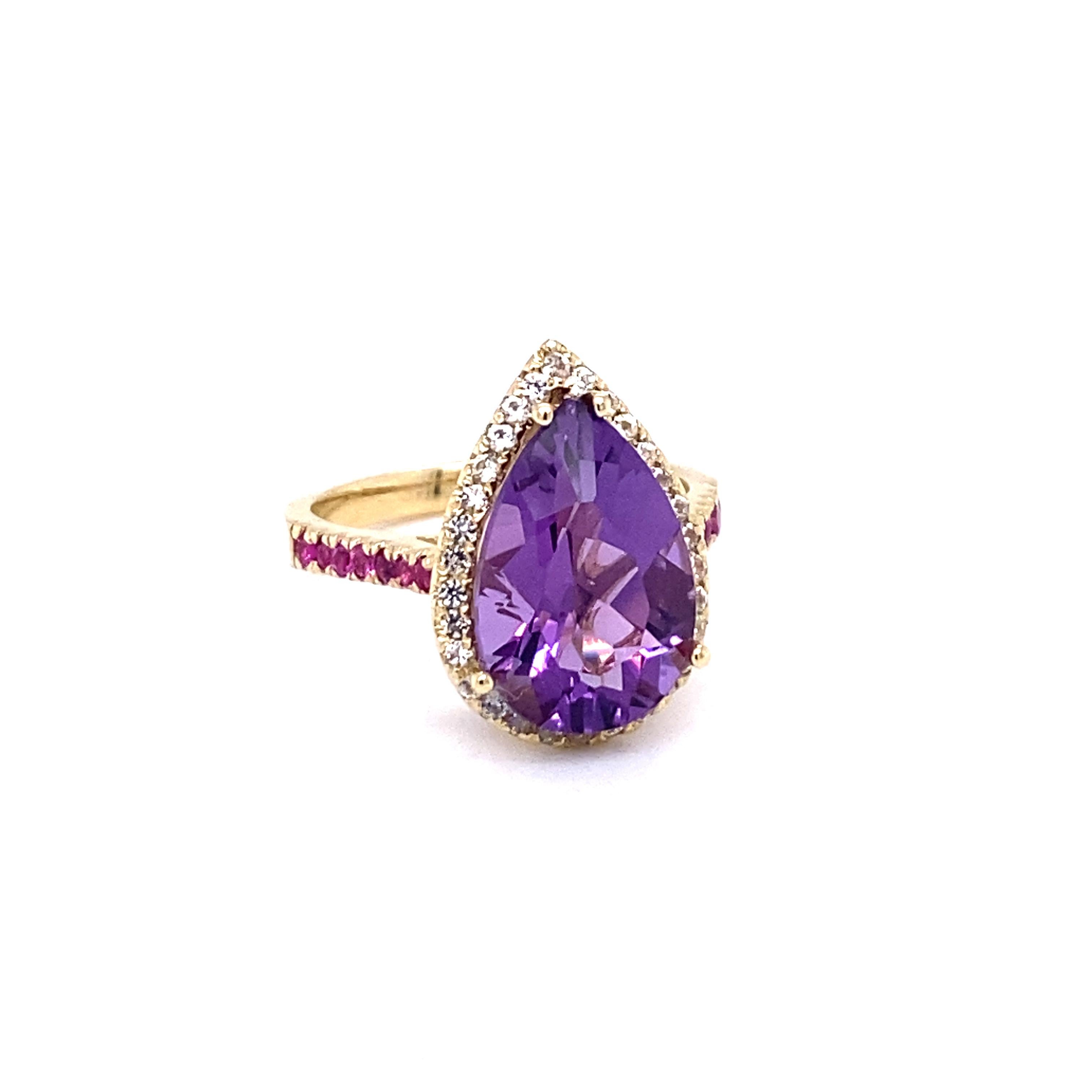 This Ring has a Pear Cut Amethyst that weighs 4.53 Carats and is embellished with a Halo 30 White Sapphires that weigh 0.35 Carats and 14 Pink Sapphires that weigh 0.30 Carats.  
The total carat weight of the ring is 5.18 Carats. 

The Amethyst has