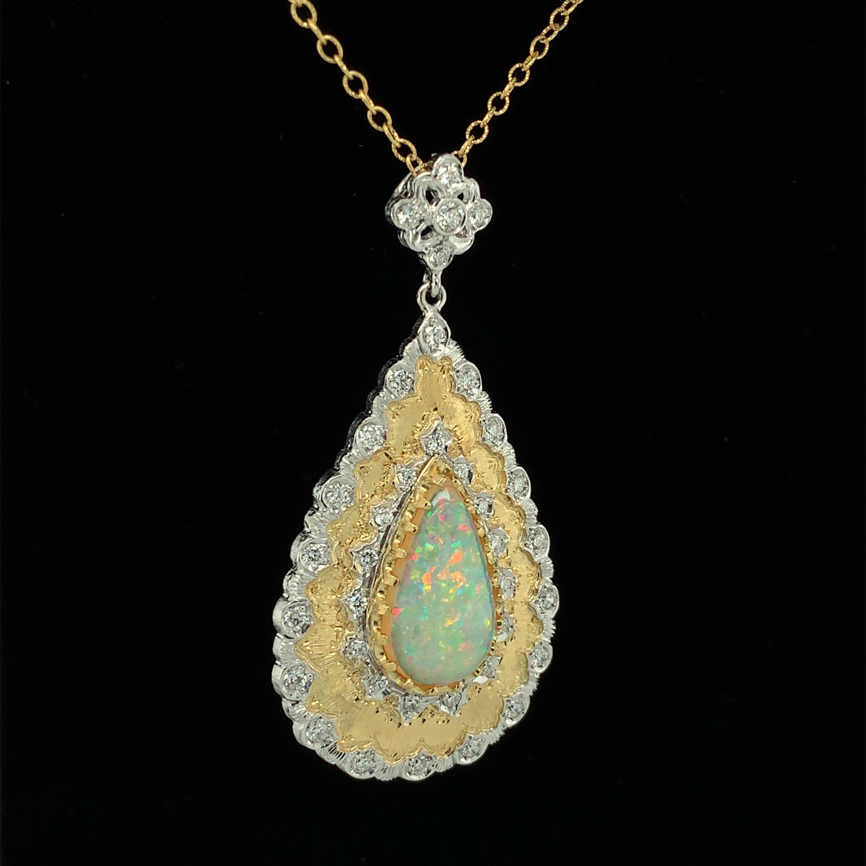 This magnificent drop pendant necklace features a stunning, 5.18 carat pear shaped Australian opal with exceptional play-of-color, also known as an opal's 