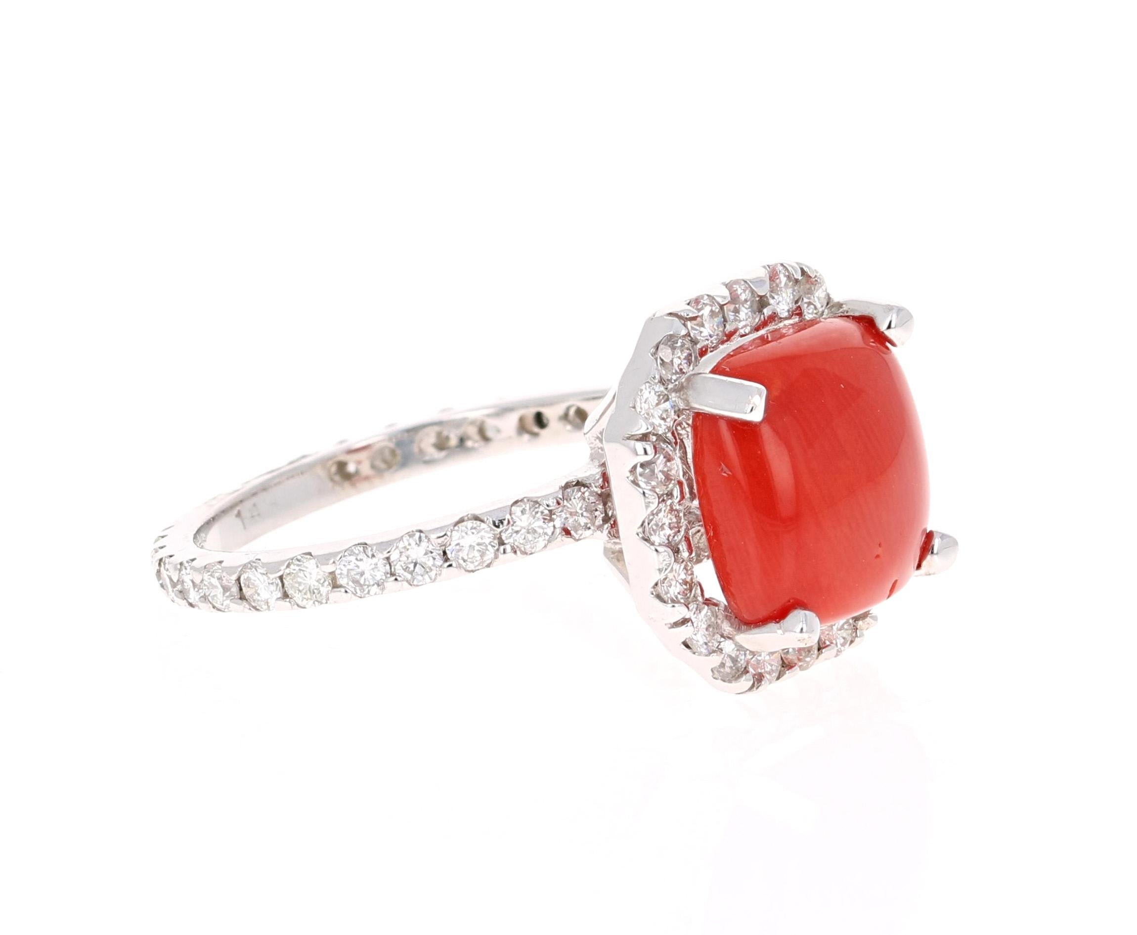 If you want the most unique Engagement Ring on the planet, this one is for you! A beautiful Red-Orange Coral! An organic gem!

This ring has has a Square Cushion Cut 4.08 Carat Coral and is surrounded by 44 Round Cut Diamonds that weigh 1.10 carats.