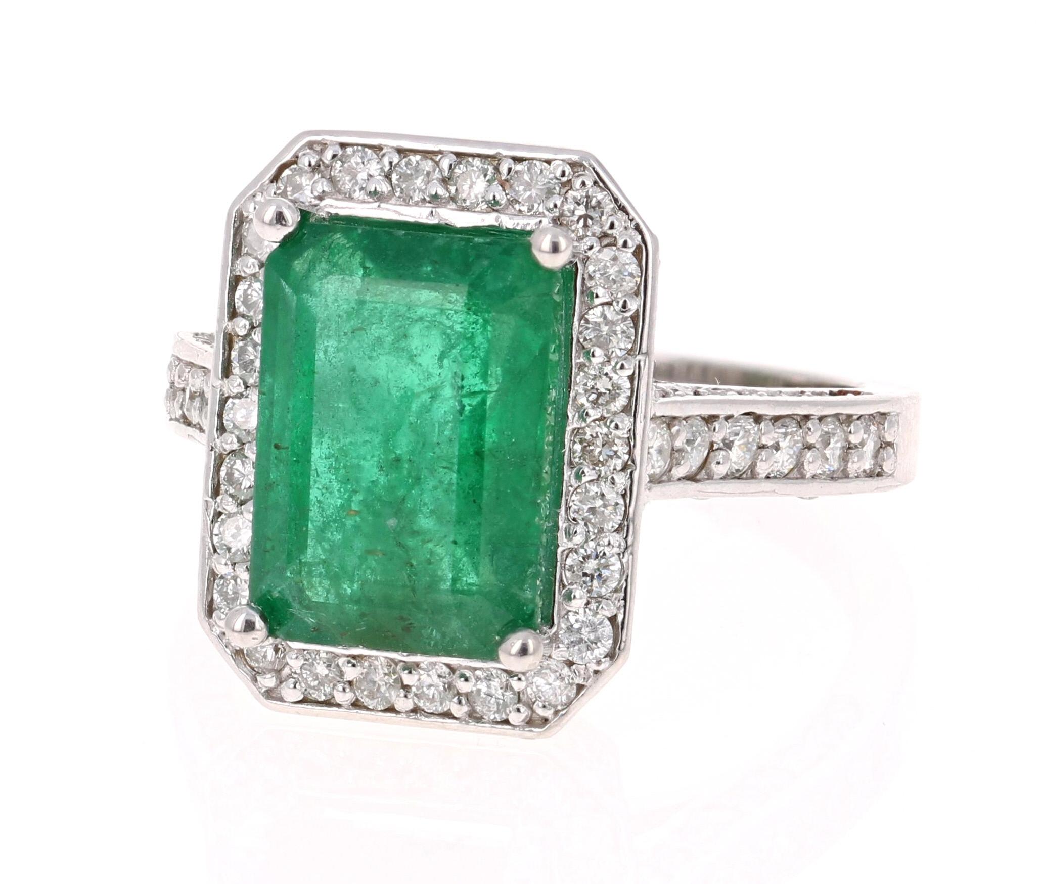 A beautiful classic vintage-looking setting holding a magnificent natural Emerald that weighs 4.11 carats.  

The measurements of the Emerald are 8mm x 11.5 mm and the face of the ring is approximately 16 mm x 12 mm. This gorgeous ring also has 120