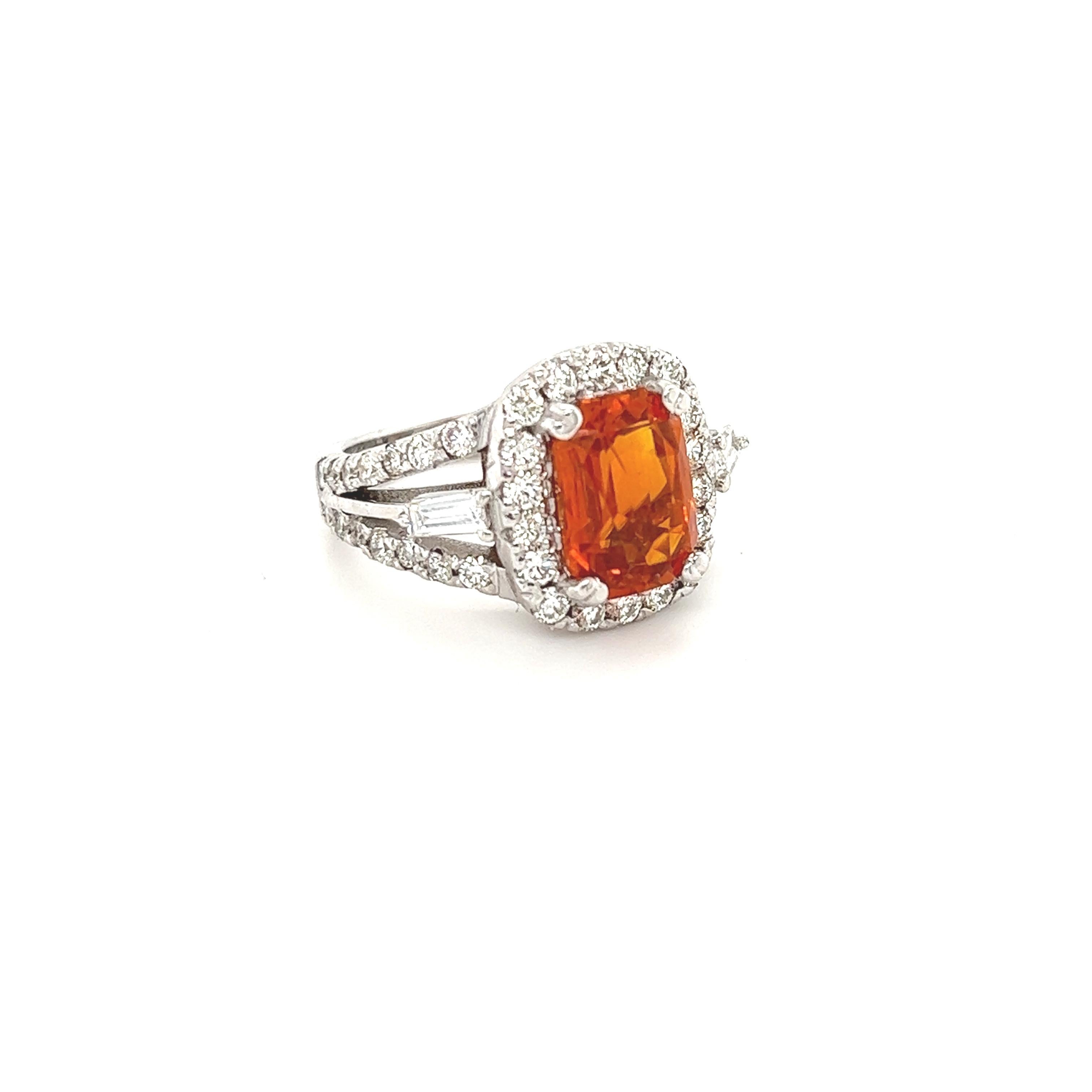 A Unique Orange Sapphire Ring for your collection!

This beautiful ring has a large Natural Cushion Cut Orange Sapphire that weighs 4.01 Carats. The Orange Sapphire is GIA Certified: #2221314213

It is surrounded by a large halo of 44 Round Cut