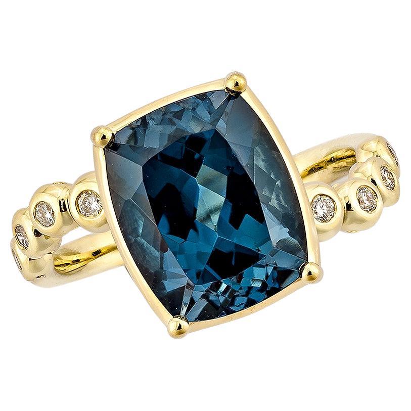 5.18 Carat London Blue Topaz Fancy Ring in 18Karat Yellow Gold with Diamond.