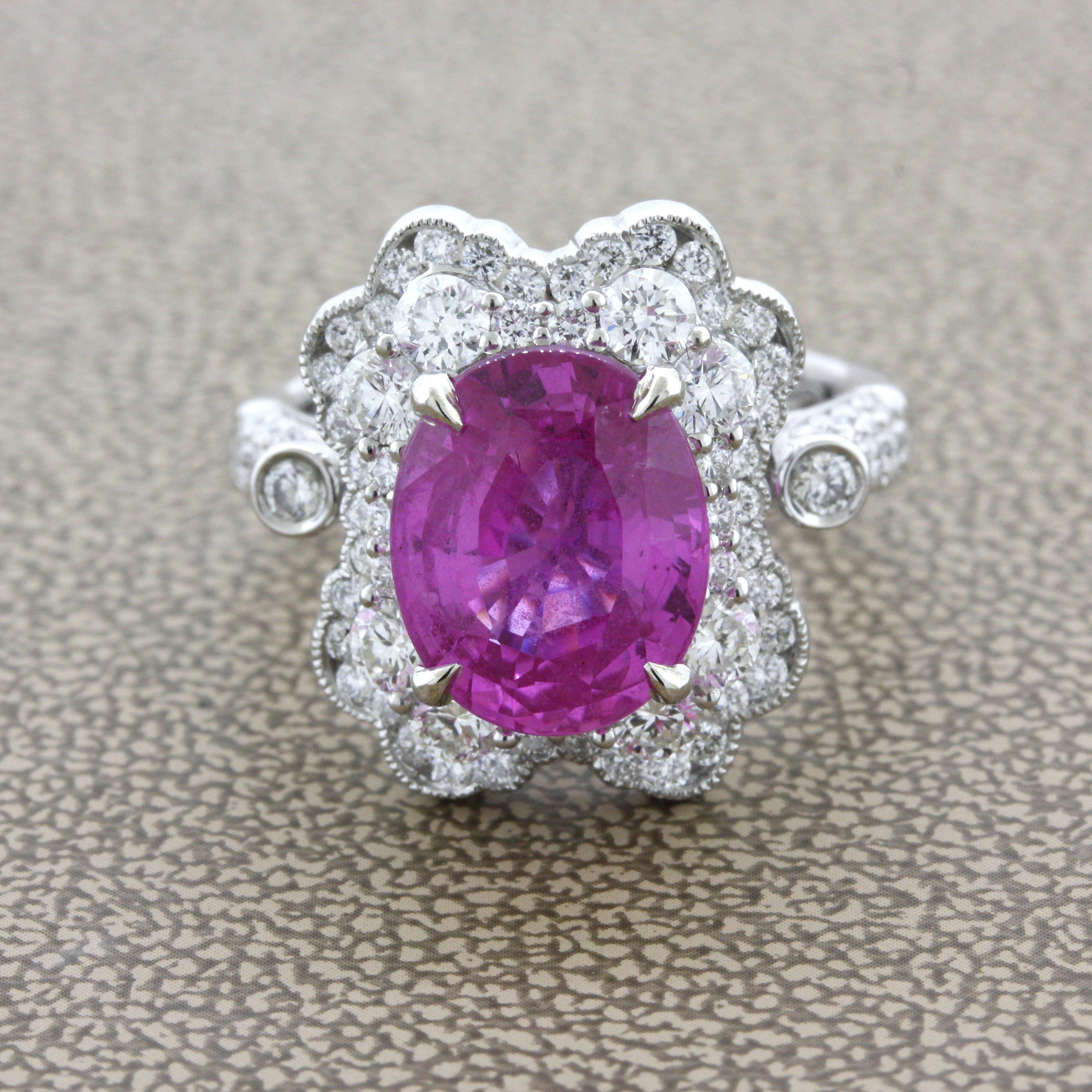 A rich hot-pink sapphire takes center stage weighing an impressive 5.18 carats. The color of the sapphire is sharp and bright as the crystal is very clean, eye clean. It has been certified by the AGL as having a pure pink color and almost treatment