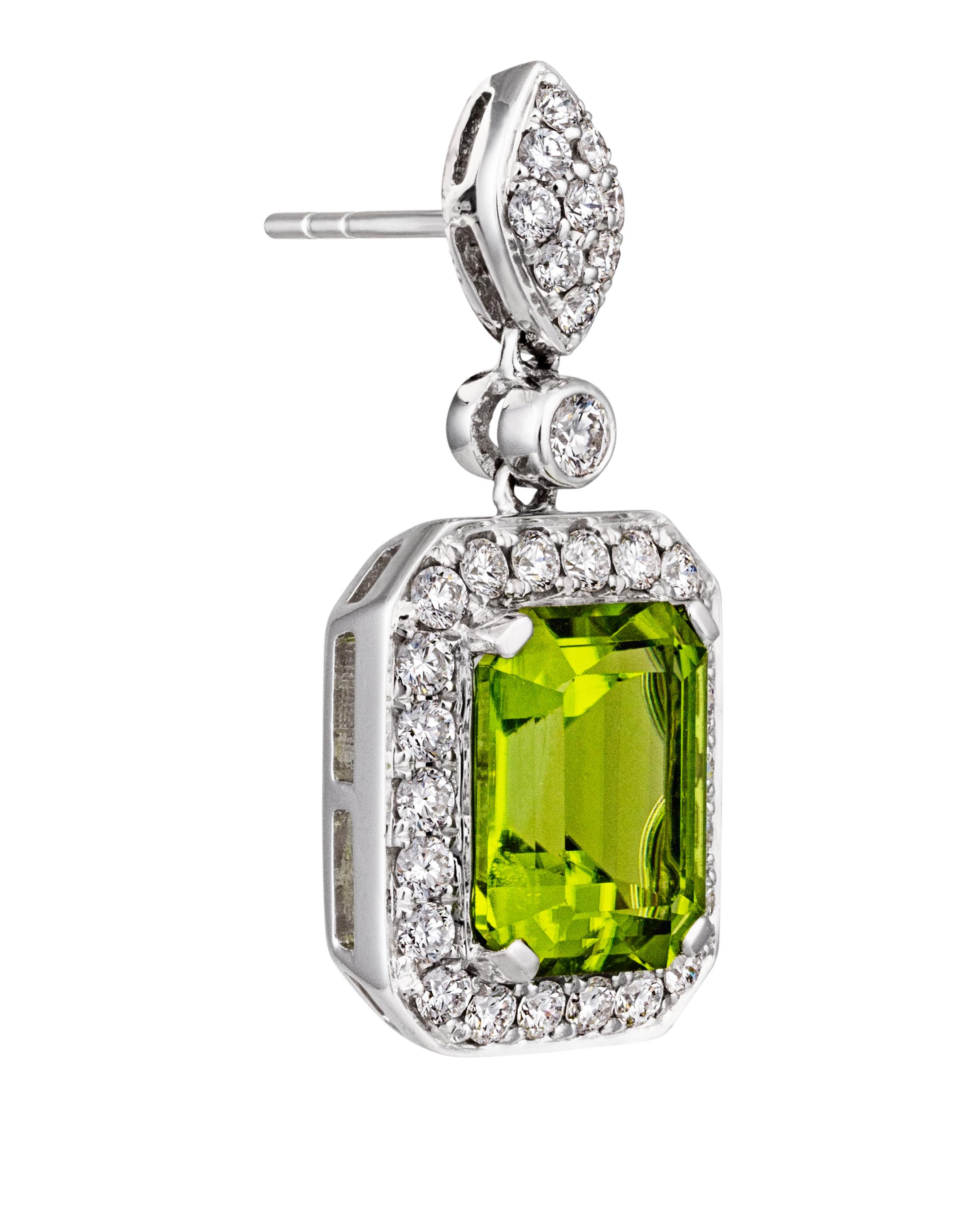 Beautiful 5.18cttw Peridot Gems surrounded by .86cttw Diamonds on 18kt White Gold Hooks. With the highest quality materials and intricate design, these earrings will make you feel like you're a royal in the Renaissance Age. Only one pair is