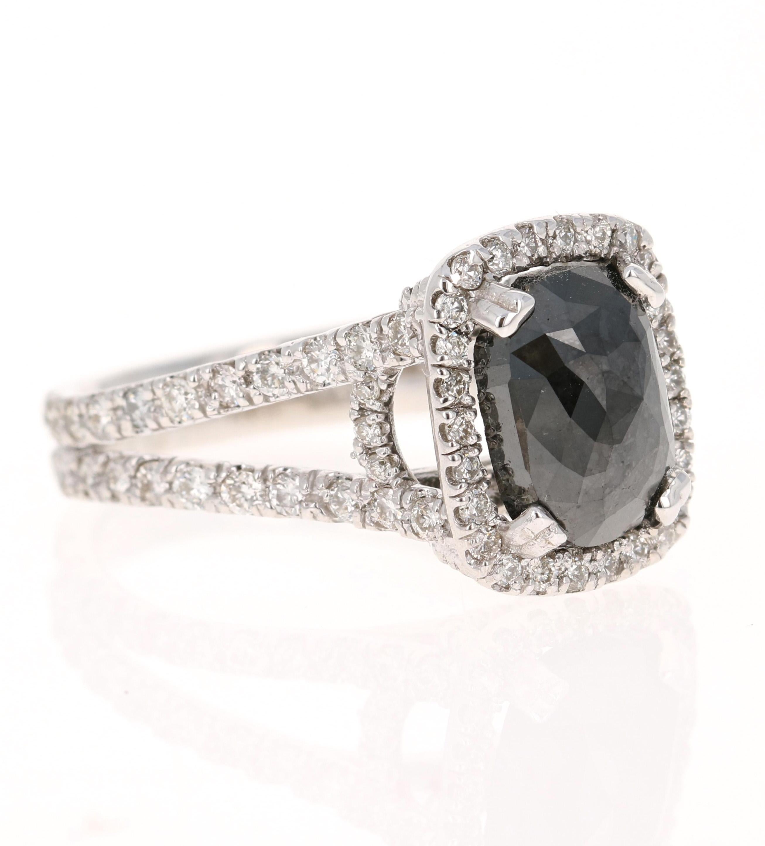 The Rectangular Cushion Cut Black Diamond is 3.84 Carats and is surrounded by 88 Round Cut Diamonds weighing 1.35 Carats. (Clarity: VS, Color: H) The total carat weight of the ring is 5.19 Carats. 

It is beautifully set in 14 Karat White Gold and