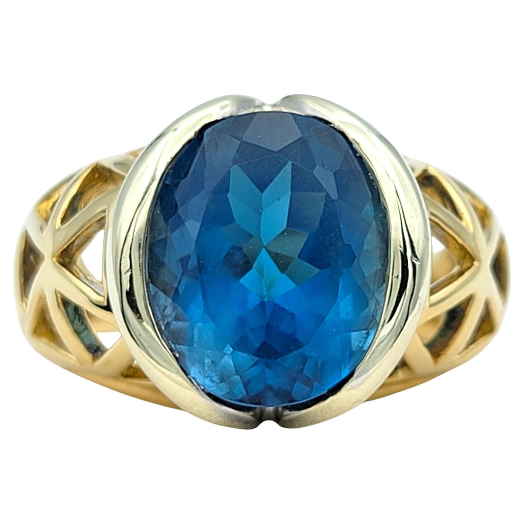 Bague bicolore en or 14 carats avec topaze bleue suisse de taille ovale de 5,19 carats