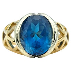 5,19 Karat Ovalschliff Schweizer Blautopas Ausschnitt Ring in zweifarbigem 14 Karat Gold