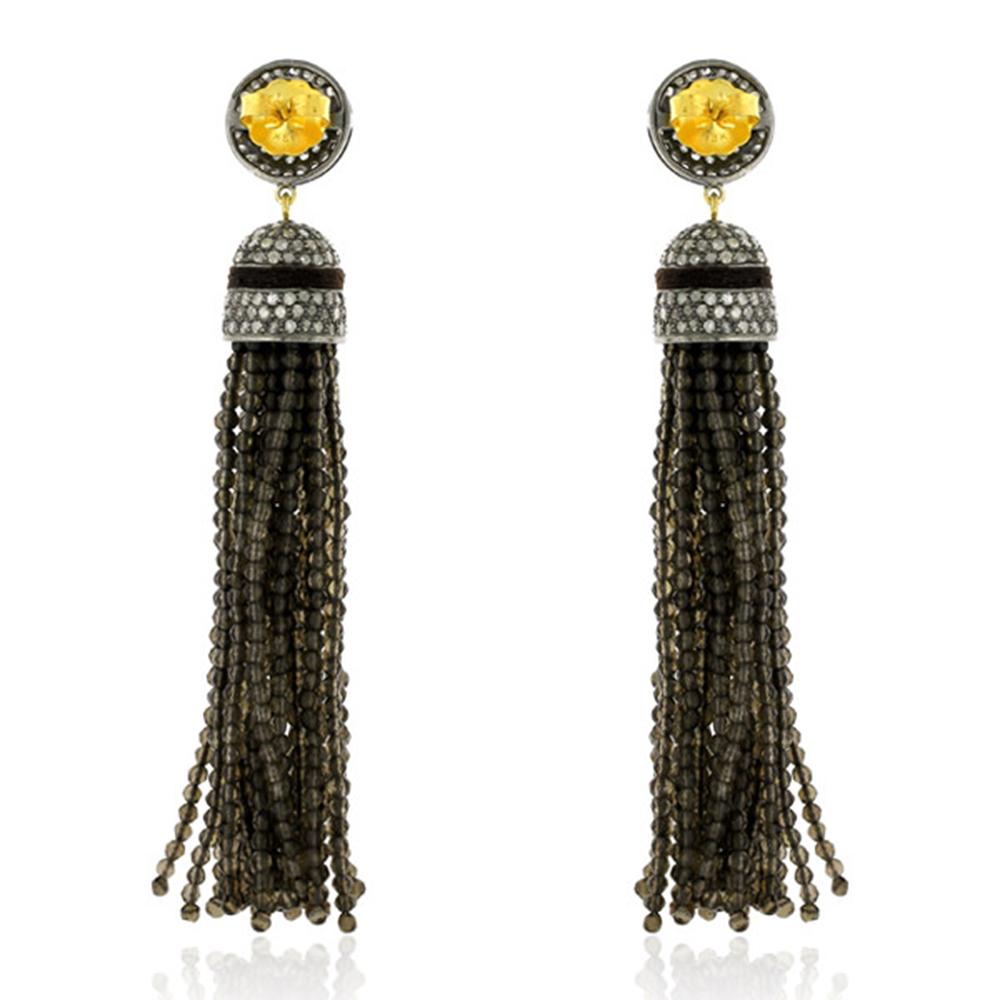 Lovely 5.19cts Diamond with Brown Quartz Tassel Dangle Earring in Gold and Silver is casual and stylish.

18kt gold: 1.89gms
Diamond: 5.19cts
Silver: 13.86gms
Quartz: 84.62cts
