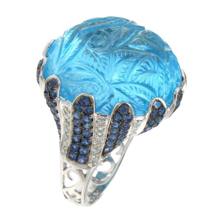 Bague en or 18 carats sertie d'une topaze bleue de 51,60 ct et d'un saphir bleu de 2,18 ct en vente