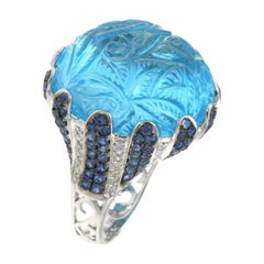 Bague en or 18 carats sertie d'une topaze bleue de 51,60 ct et d'un saphir bleu de 2,18 ct