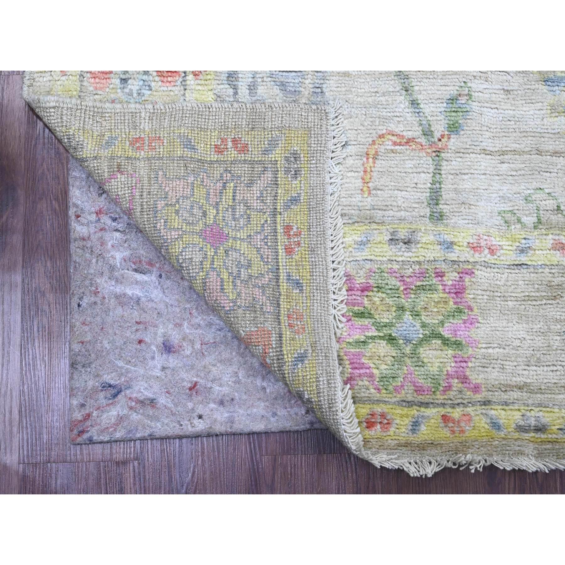 Bone White, Afghan Angora Oushak with Colorful Leaf Design, Hand Knotted, Veggie Dyes, 100% Wool, Oriental Rug
Primary materials: Wool
Latex: No Pile 
height: 0.25 Inches
Style: Transitional
Primary color: Ivory
Secondary colors: Yellow, Red, Green,