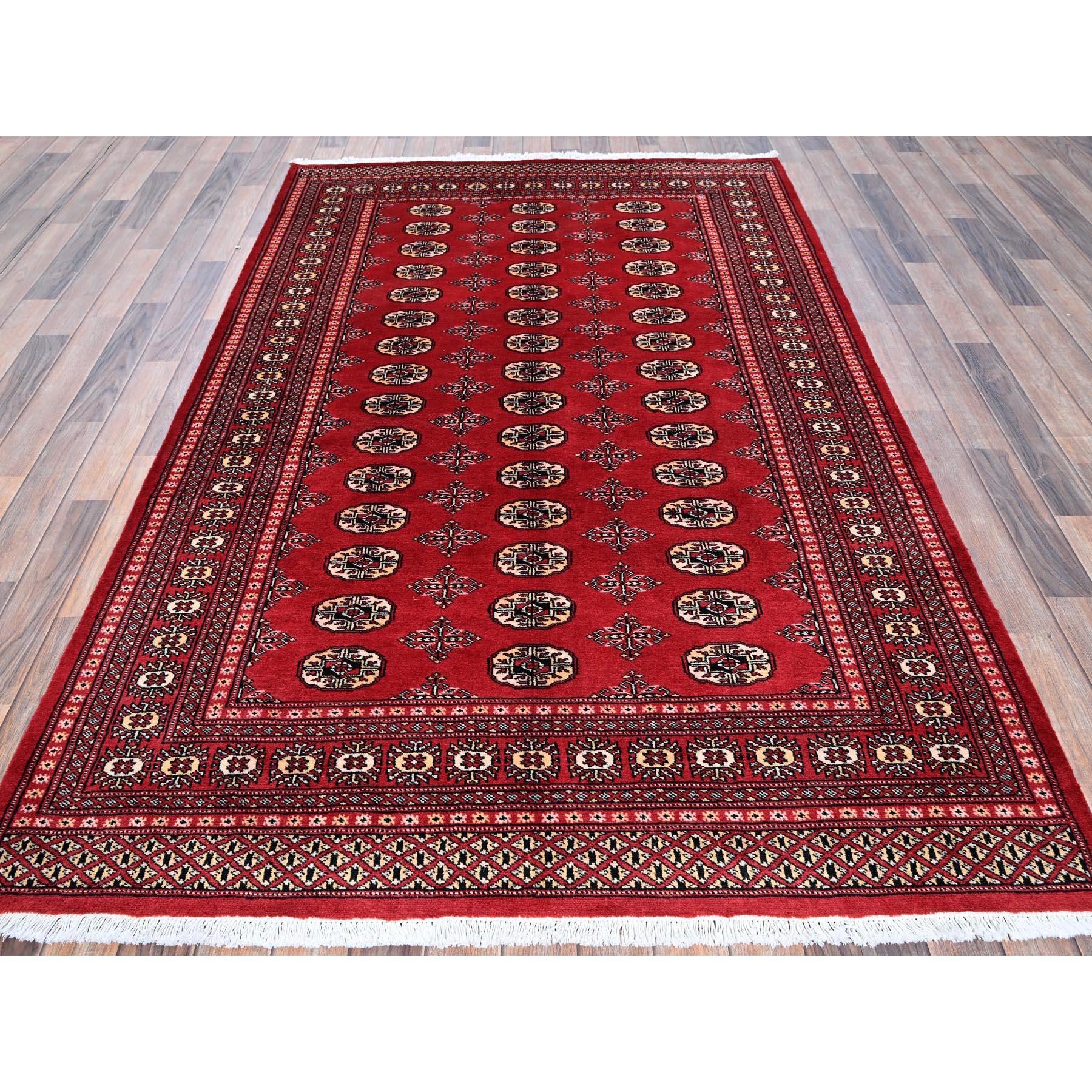 Chili Red, Princess Bokara with Geometric Medallions, Vegetable Dyes, Soft and Shiny Wool, Hand Knotted, Mat, Sample, Oriental Rug
Primary materials: Wool
Latex: No Pile 
height: 0.25 Inches
Style: Traditional
Primary color: Red
Secondary colors: