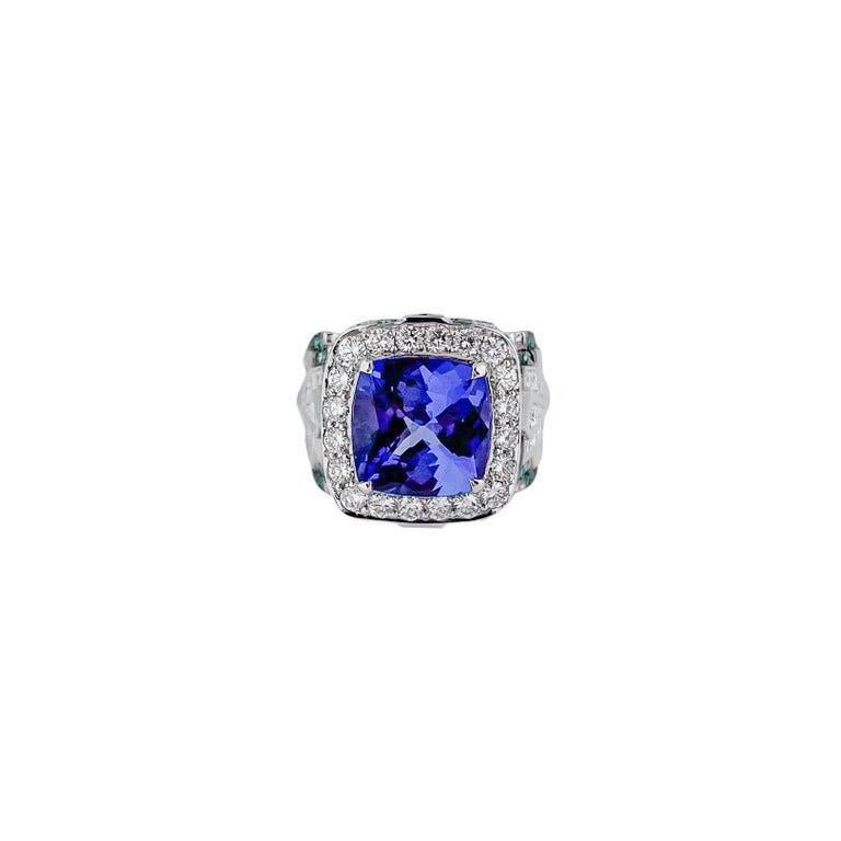 A 5.2 carat cushion cut tanzanite is the star of this show stopping cocktail ring. Accented with white diamonds and pariba to give it its modern touch. Complimentary Ring sizing and international shipping is included. 
