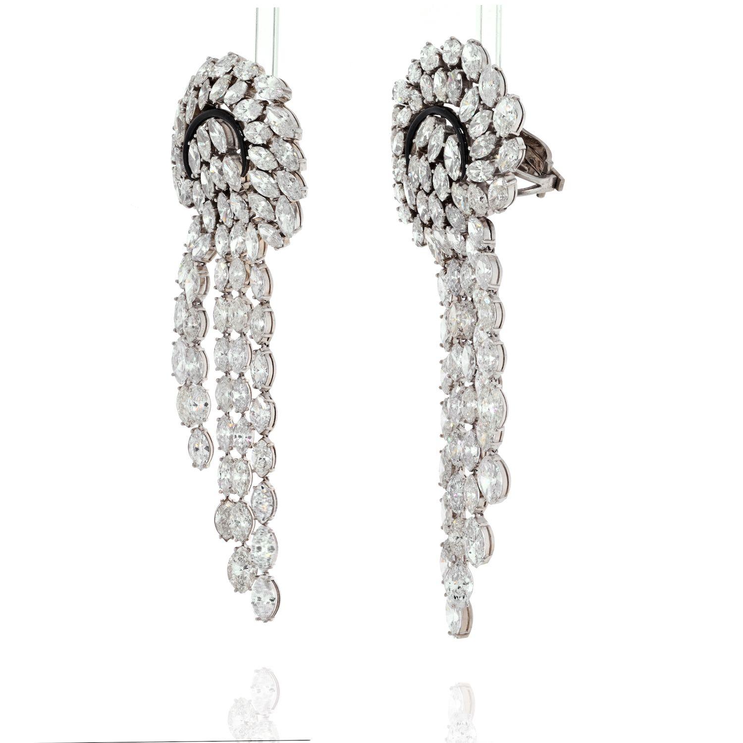 Composed of cascading lines of marquise cut diamonds, accented by black enamel swirl these fabolous earrings are made for a diva. Over 50 carats in marquise cut diamonds will certainly deliver the attention you crave. The earrings are mounting in