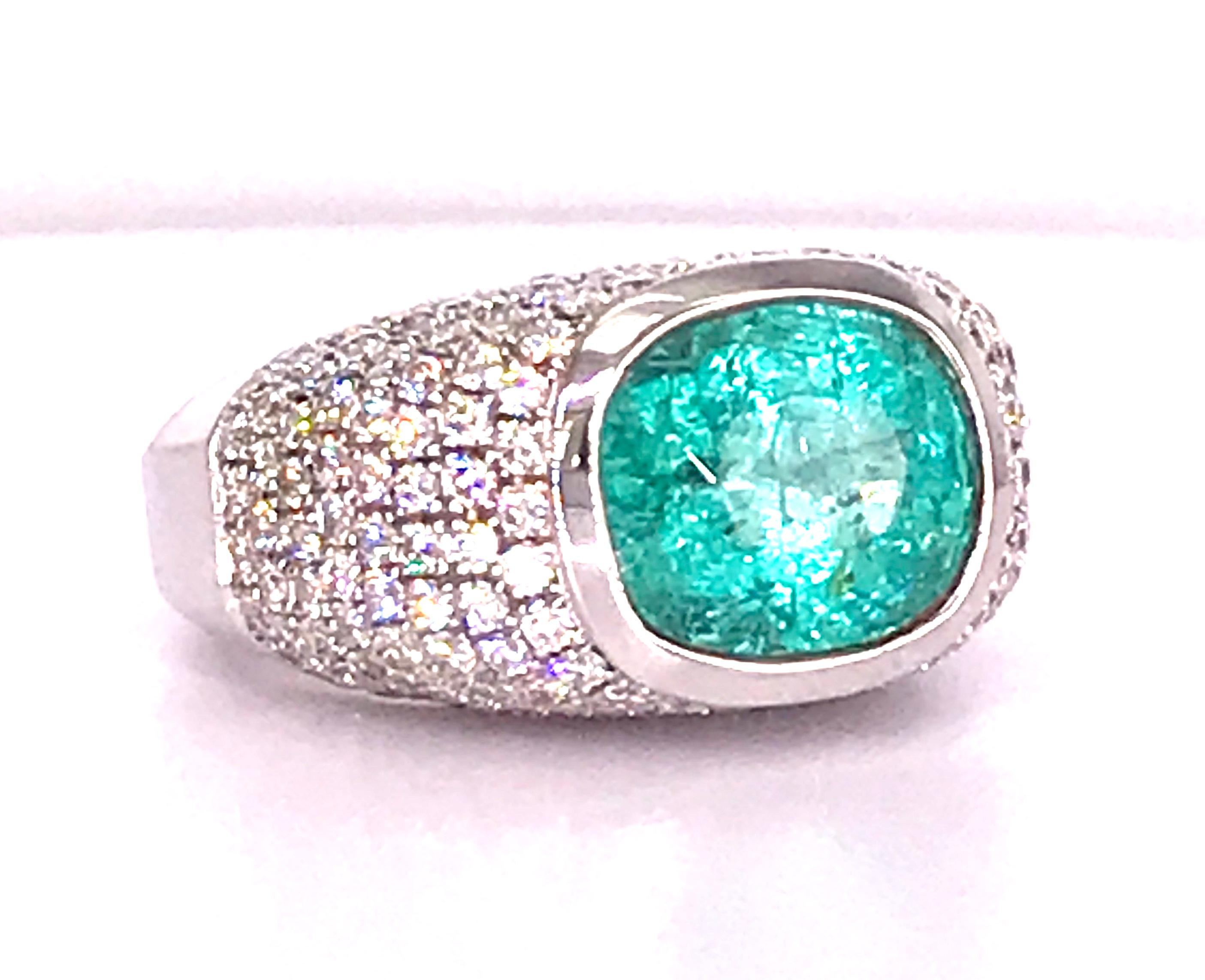 This rare Neon Blue 5.20 Carat Paraiba Tourmaline is set in white gold (14 Karat for its strength) and surrounded by 3 Carats of diamonds. The center gem measures 12.20 x 10.40 x 8.61 mm.